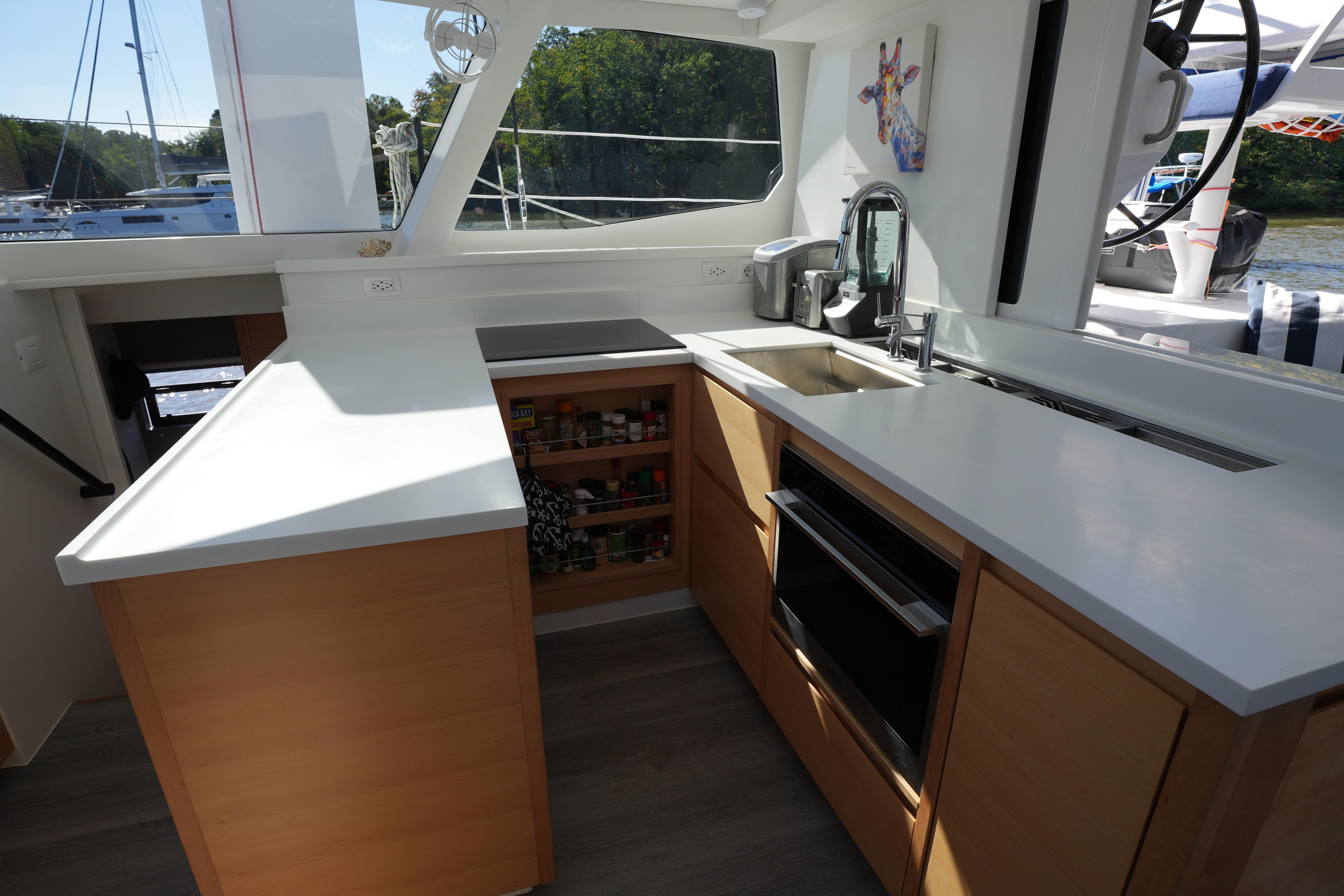Modern kitchen interior on 2024 Balance 442 yacht with sleek countertops and appliances.