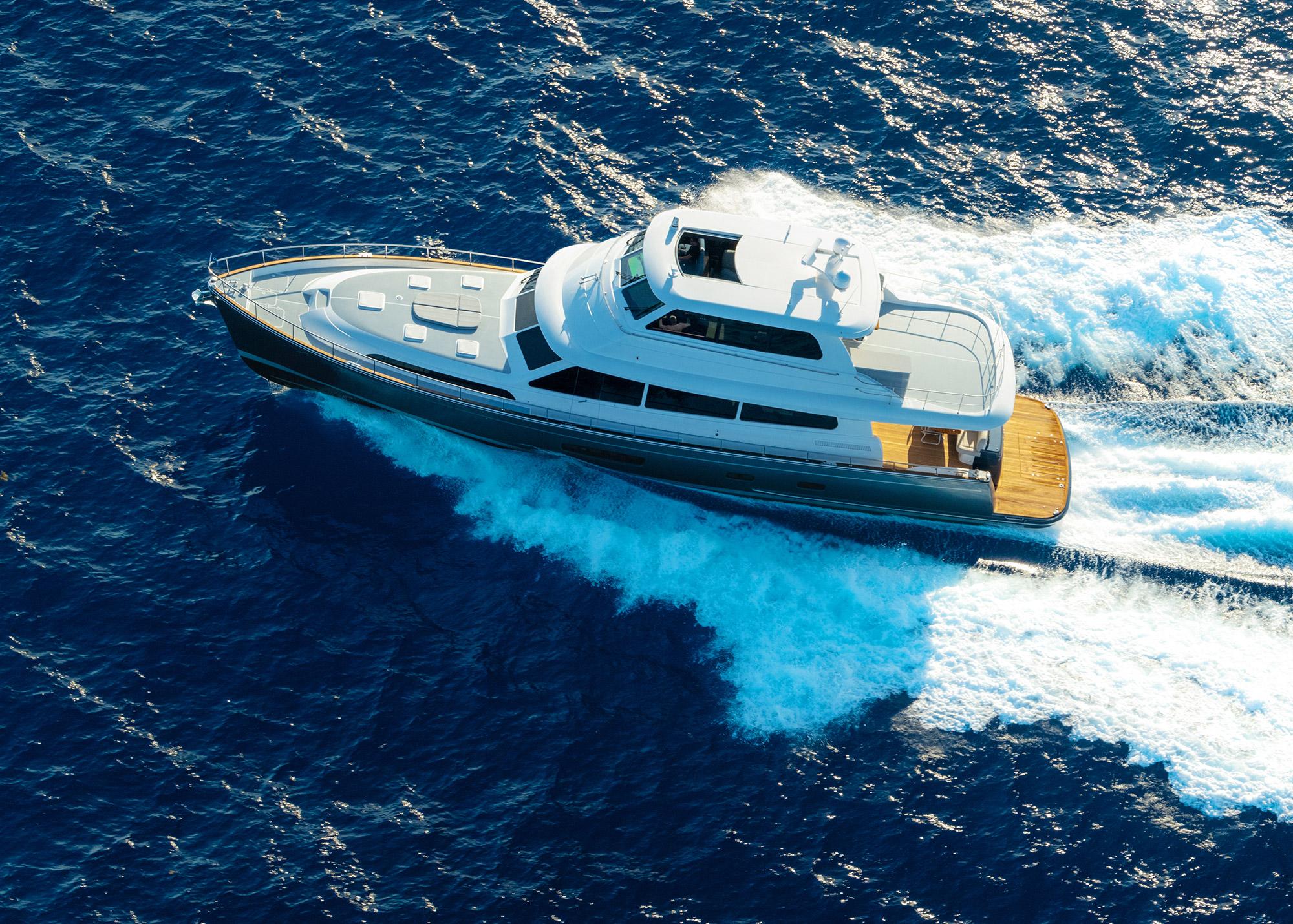 2026 Grand Banks GB 85 yacht cruising on open blue sea.