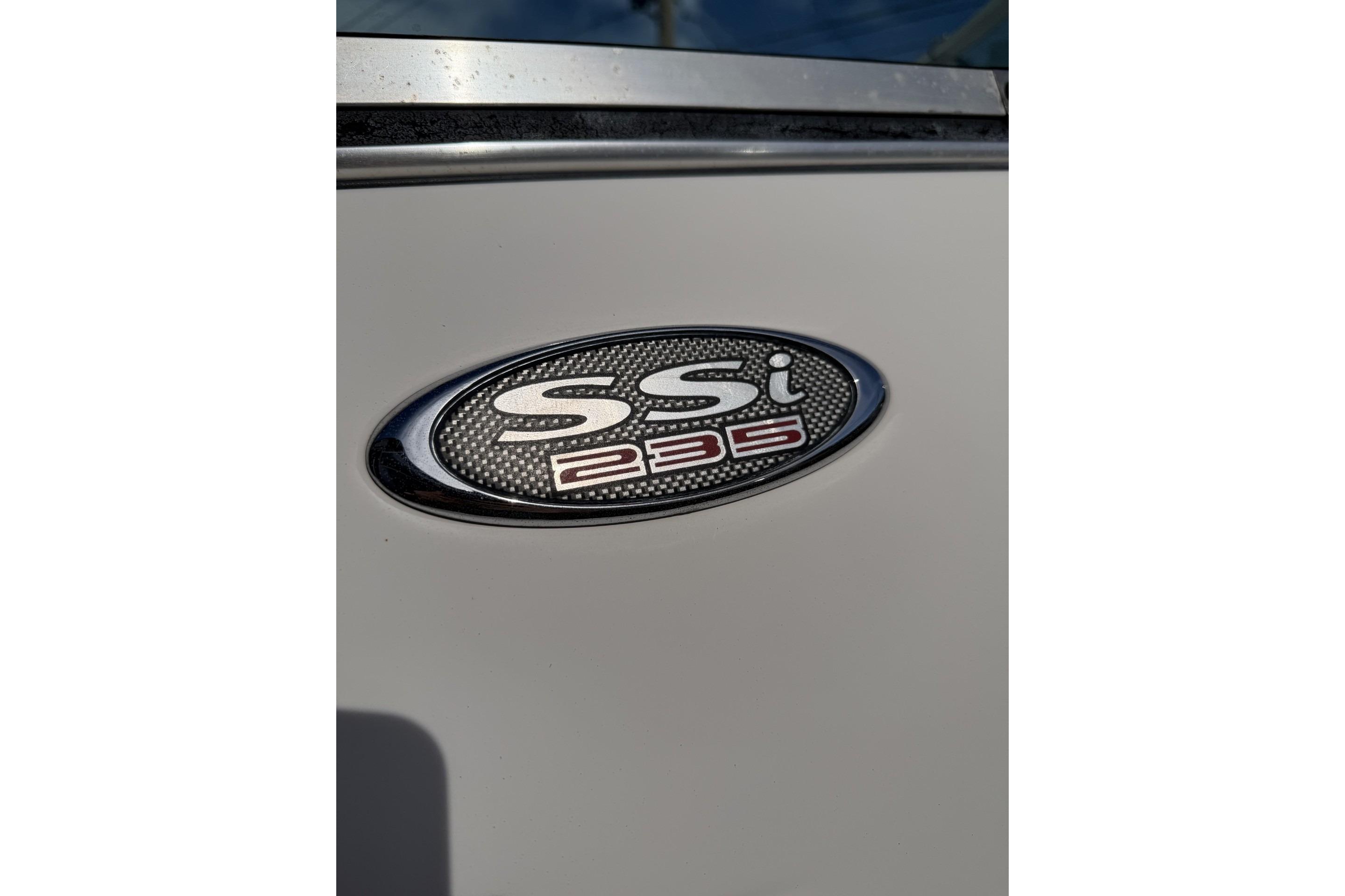 Close-up of 2001 Chaparral 235 SSi emblem on boat exterior.