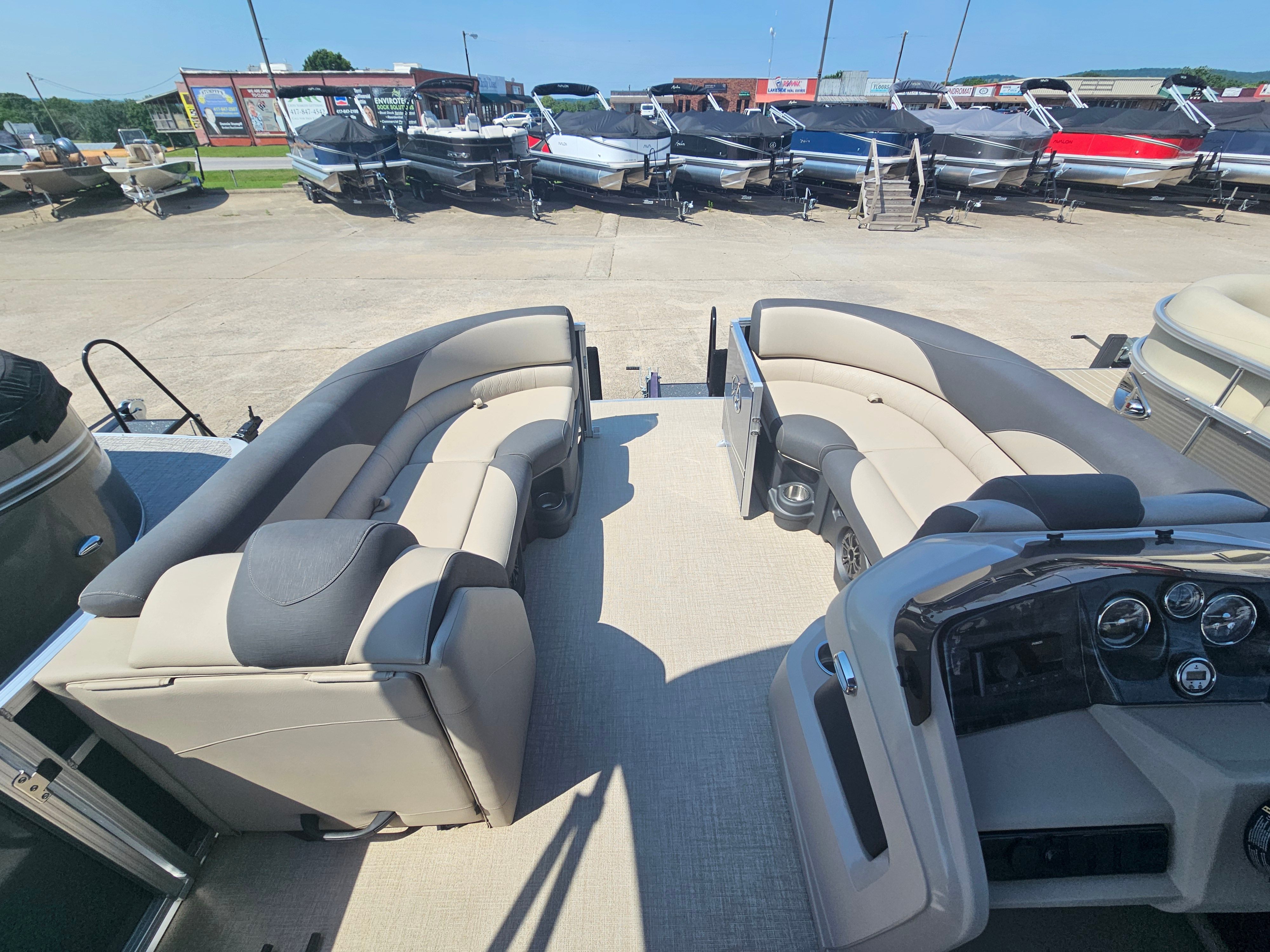 Interior of 2024 Avalon LSZ 2385 QL pontoon boat at a parking lot.