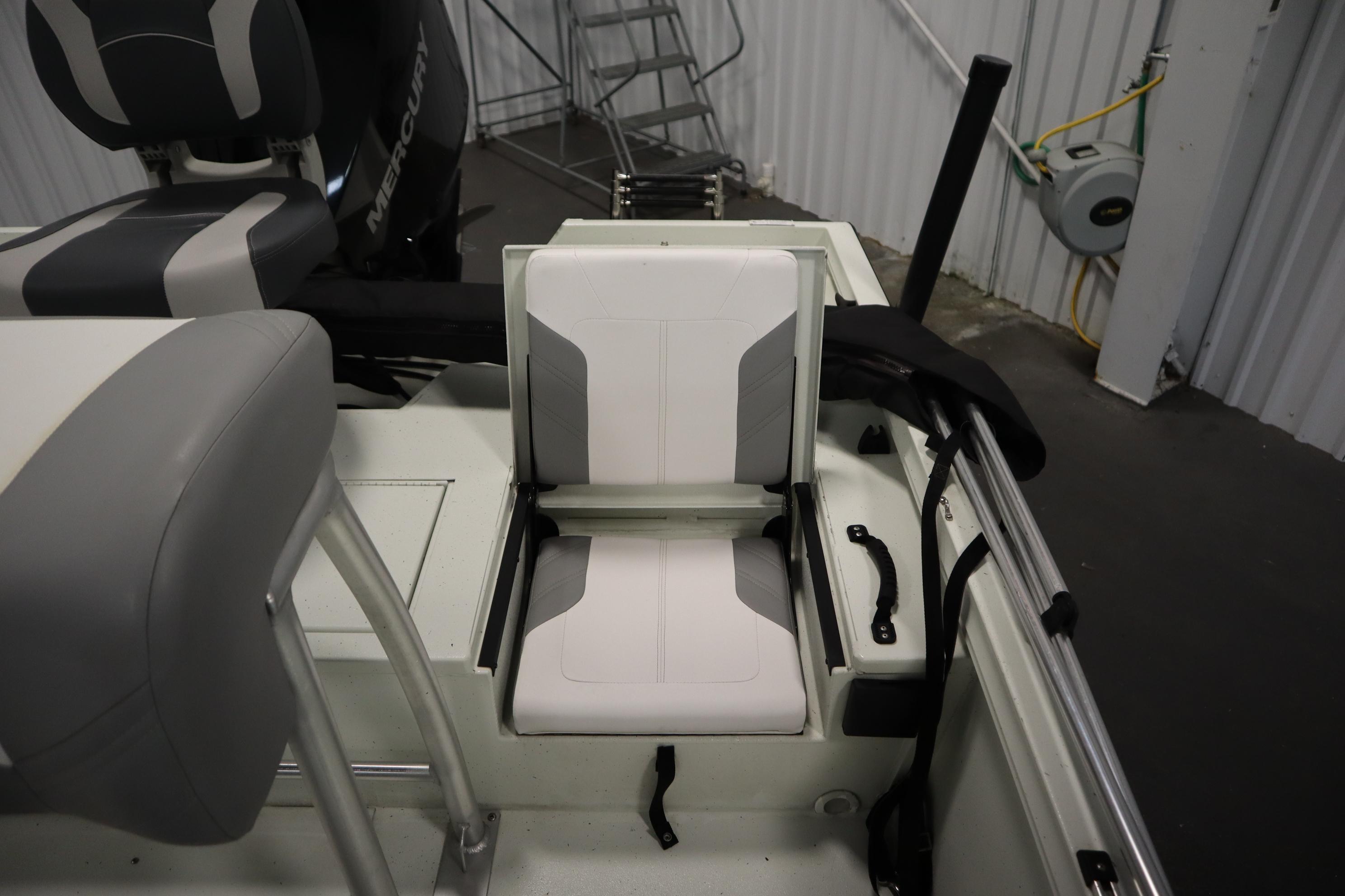 2022 Crestliner 2200 CC boat interior with foldable seating and Mercury engine.
