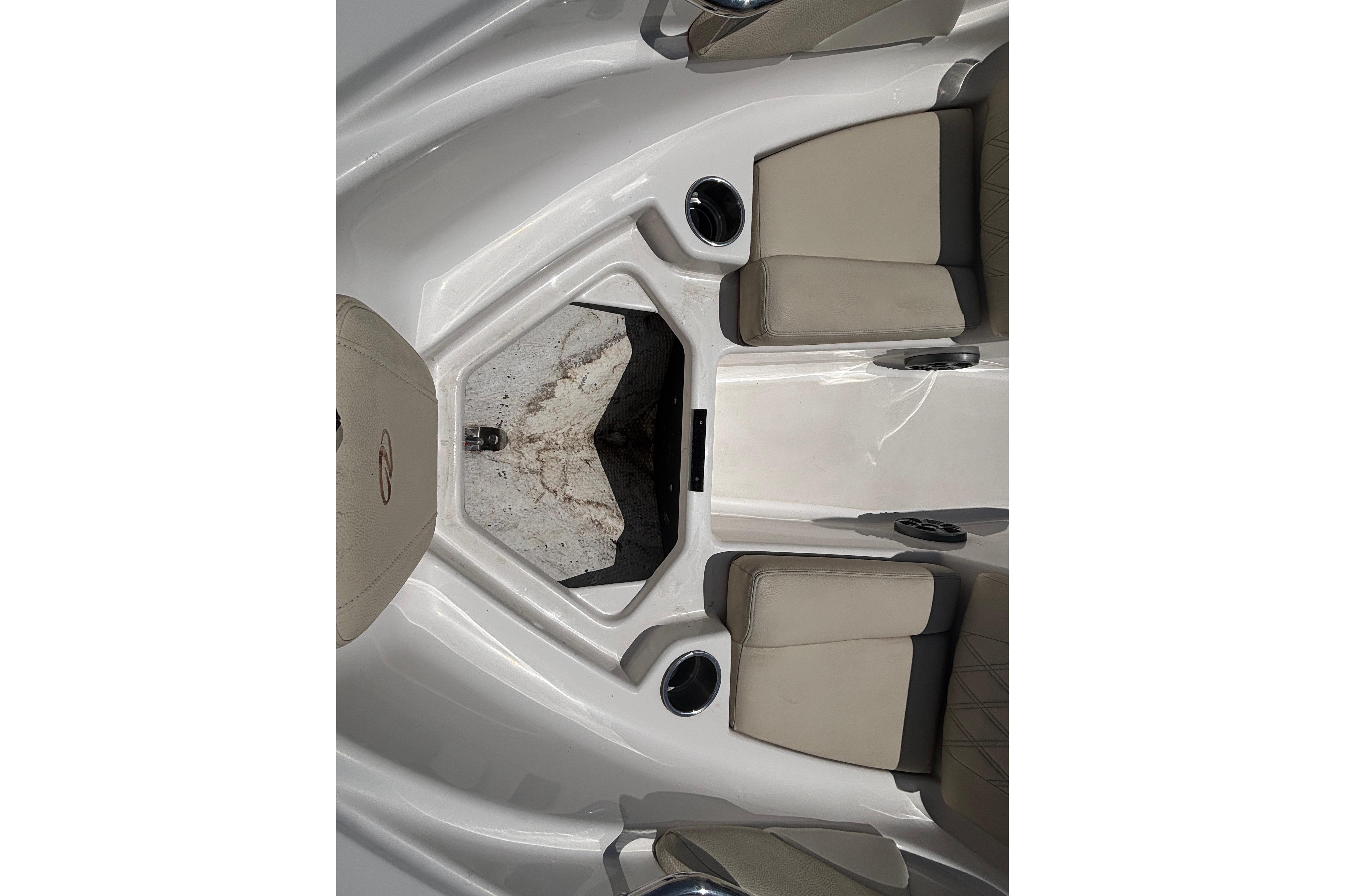 2018 Regal 1900 ES Bowrider interior with beige seating and cup holders.