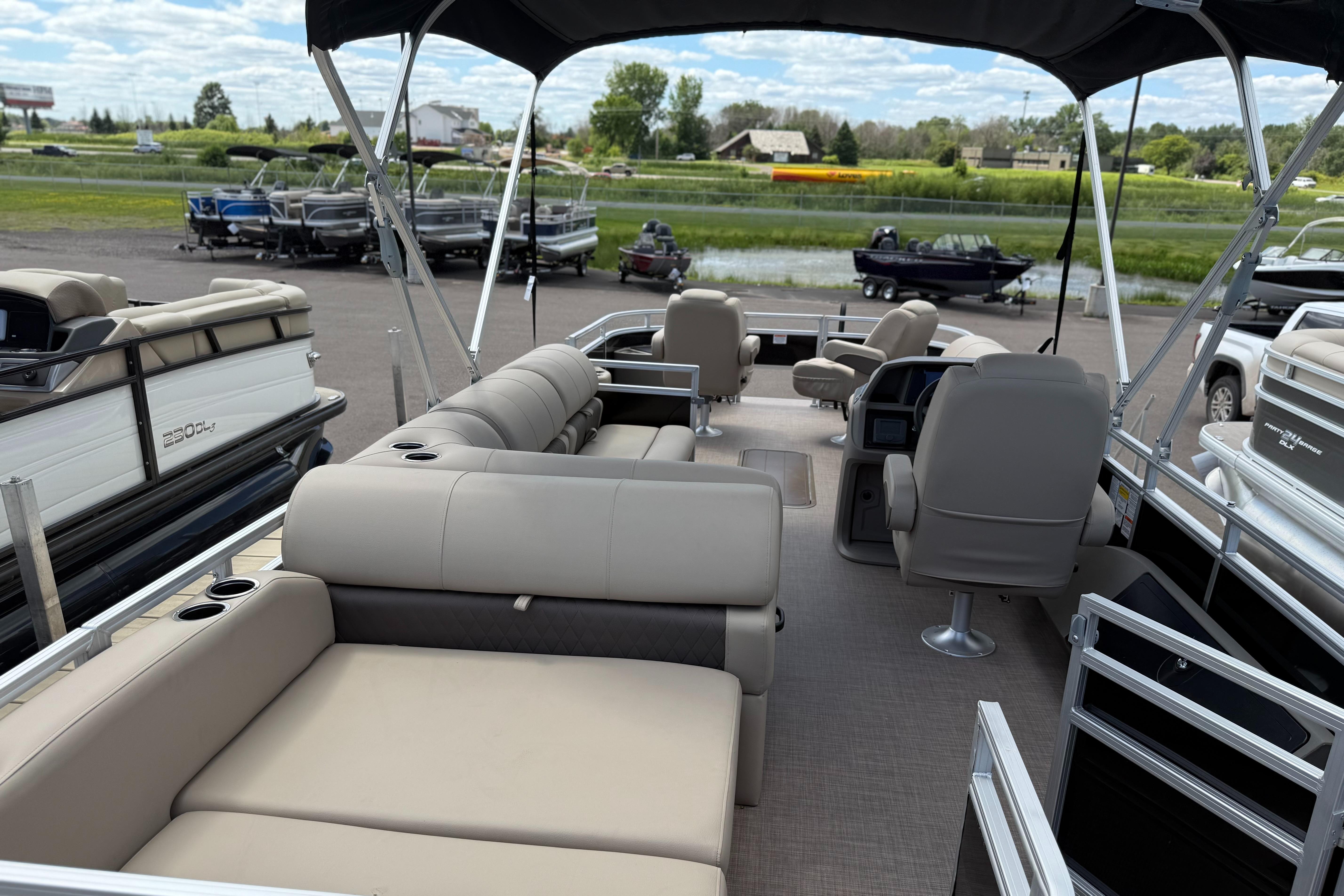 2024 Sun Tracker Sportfish 24 XP3 pontoon boat with spacious seating and modern design.