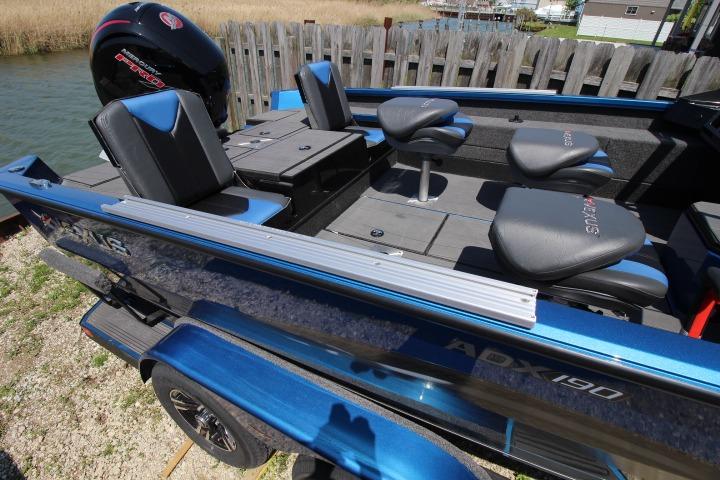 2026 Vexus ADX 190 boat with blue exterior and comfortable seating.