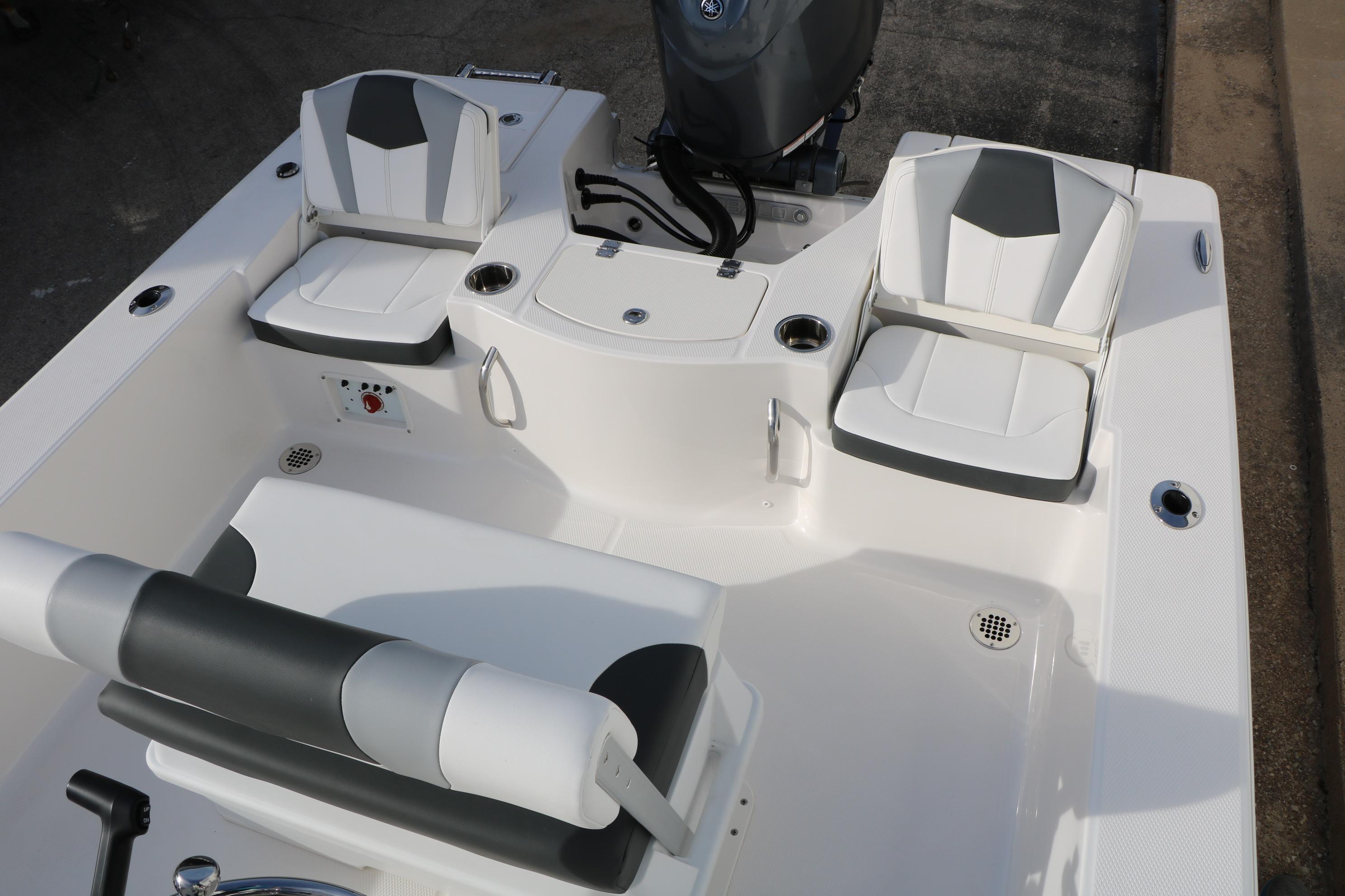 2026 Robalo 206 Cayman boat interior with seating and motor, showcasing modern design.