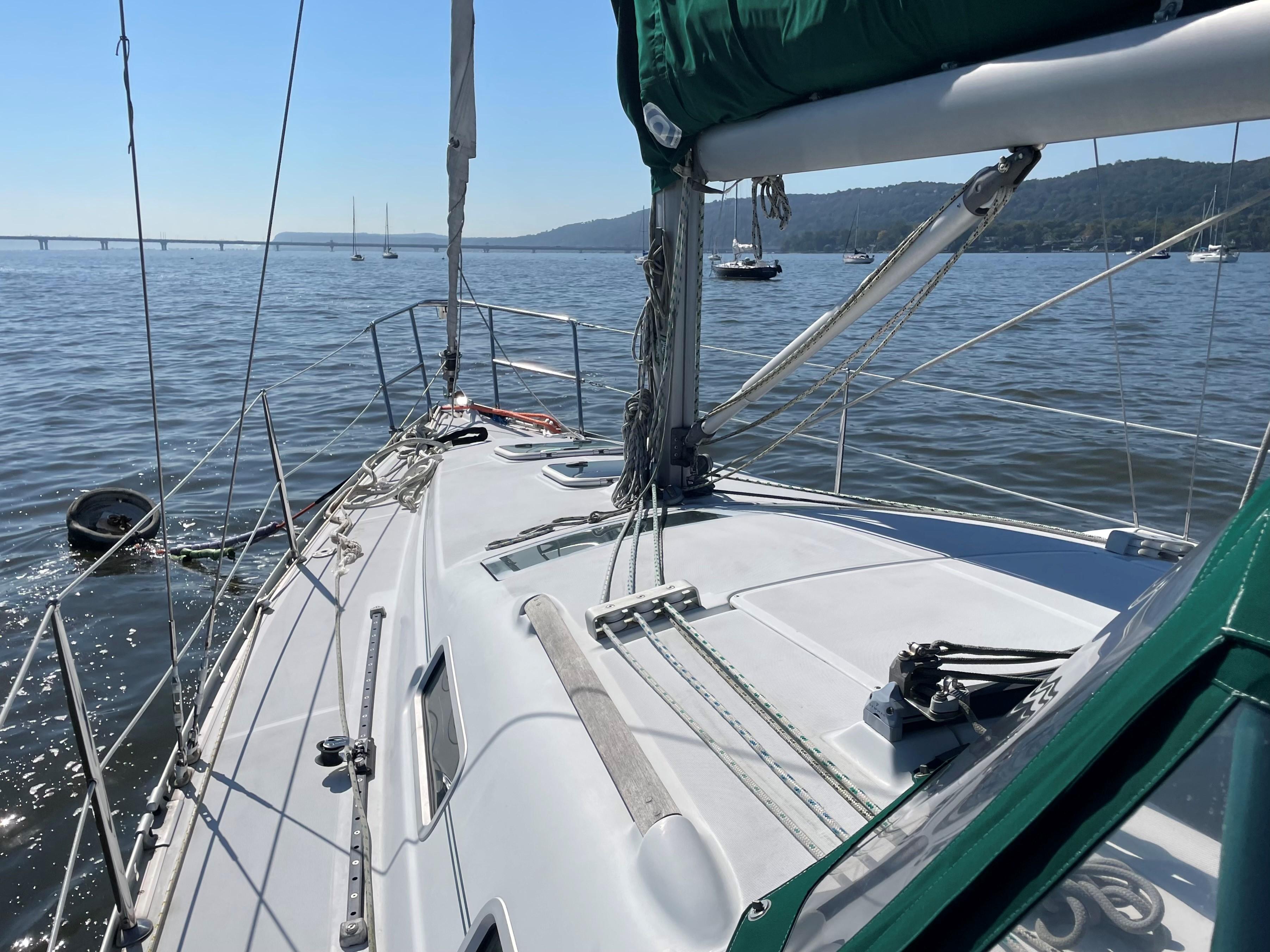 2005 Beneteau 323 sailboat on calm waters.