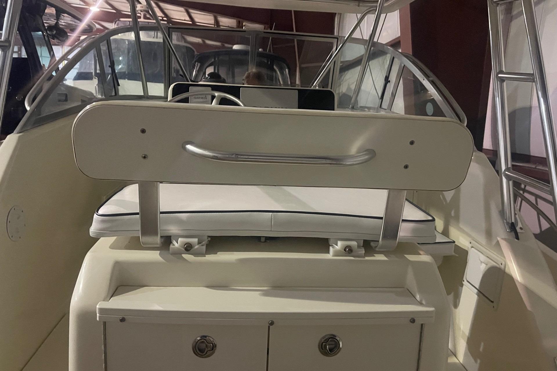 2000 Pursuit 3070 Offshore Center Console interior with seating and storage.
