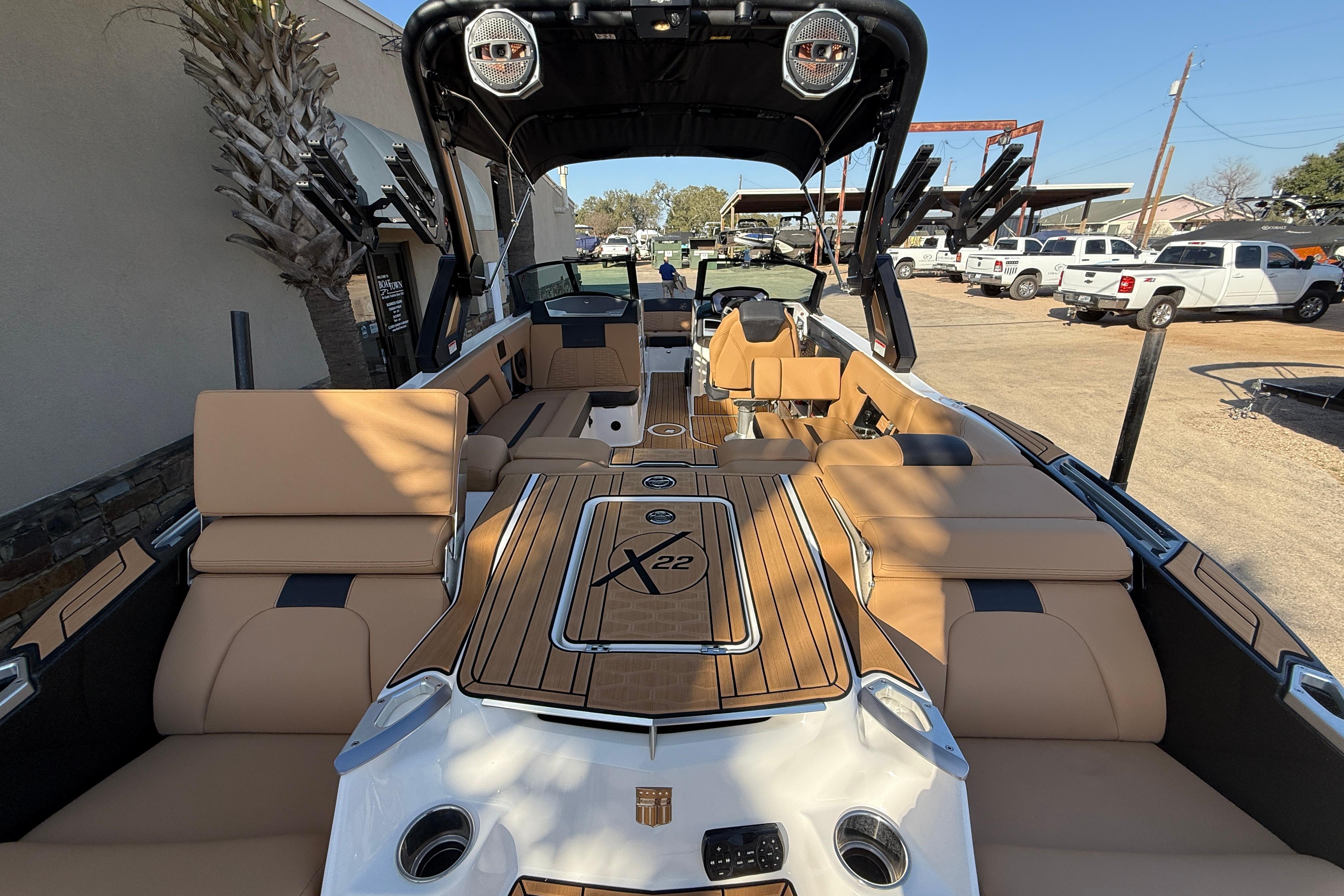 2023 MasterCraft X22 boat interior with tan seating and sleek design.