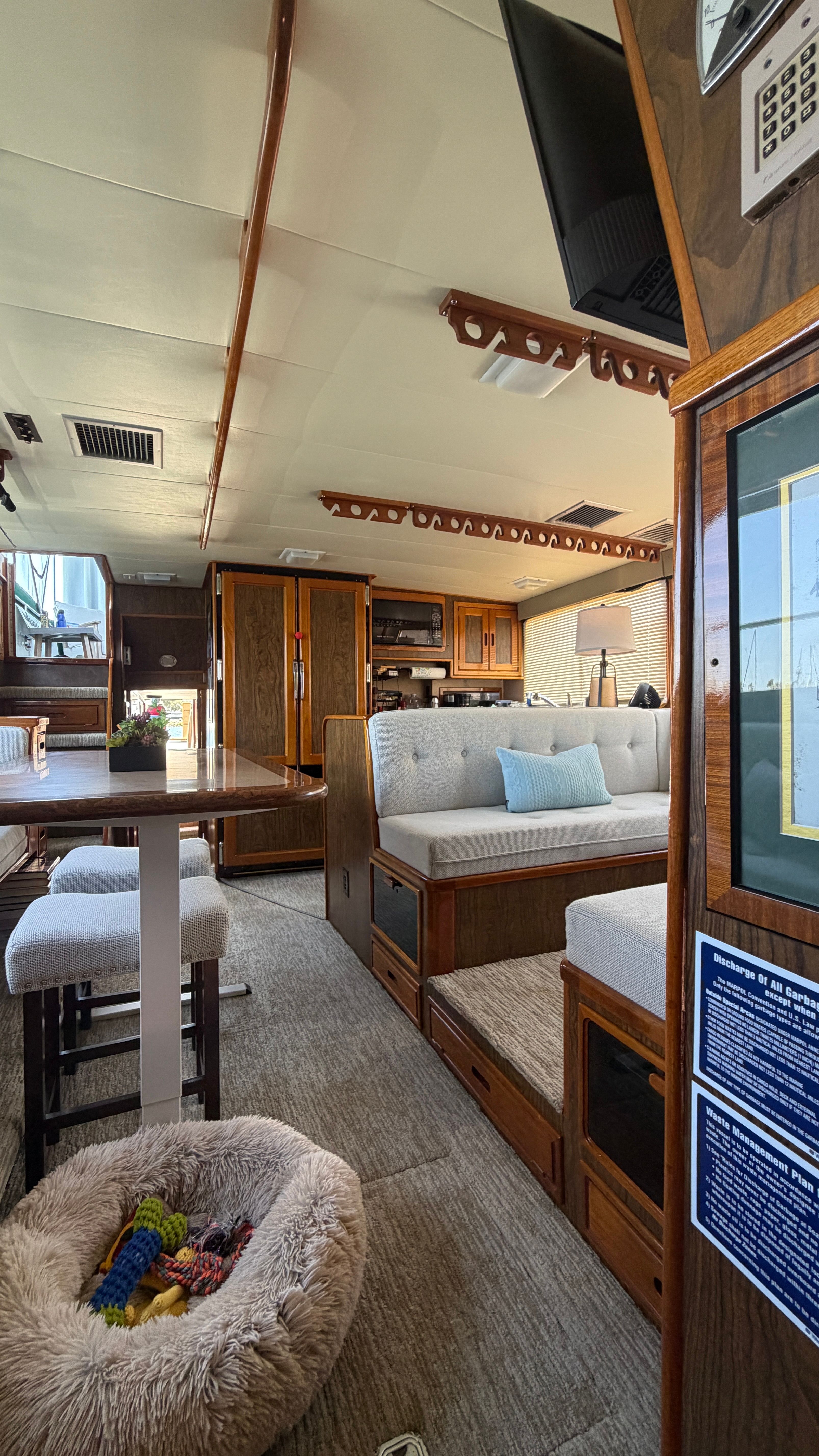 Interior of a 1966 Drake Yachtfisher with cozy furnishings.