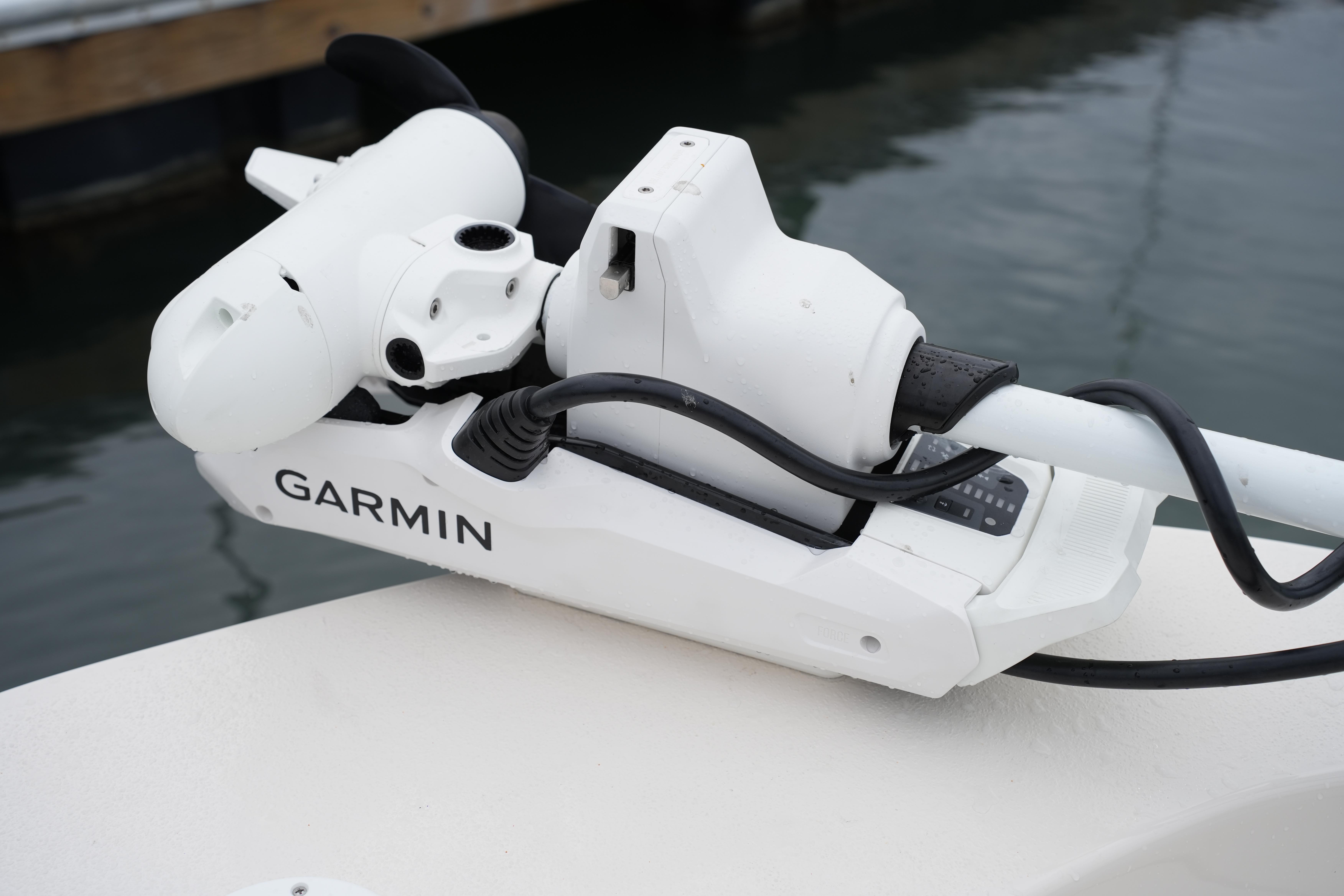 Garmin marine equipment on a 2025 Carolina Skiff 162 JLS boat, docked by the water.