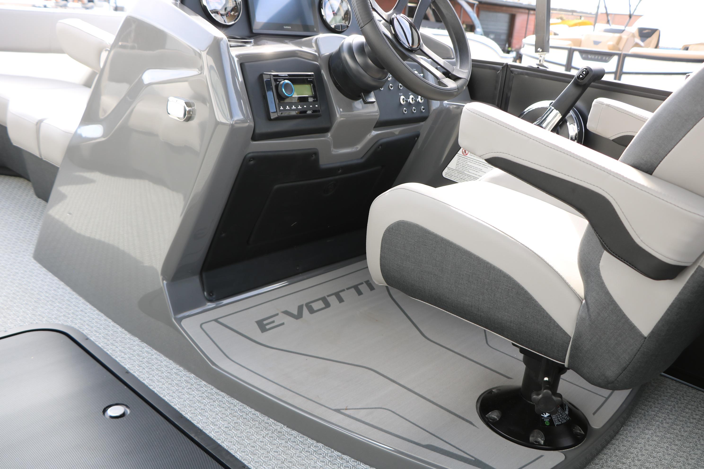 Interior of 2026 Evotti 521QL boat, featuring modern steering and control panel.