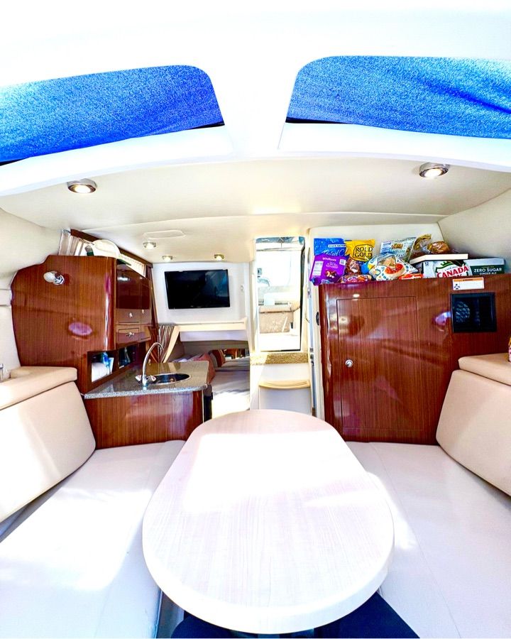 Interior of the 2014 Regal 30 Express with seating area and kitchenette.