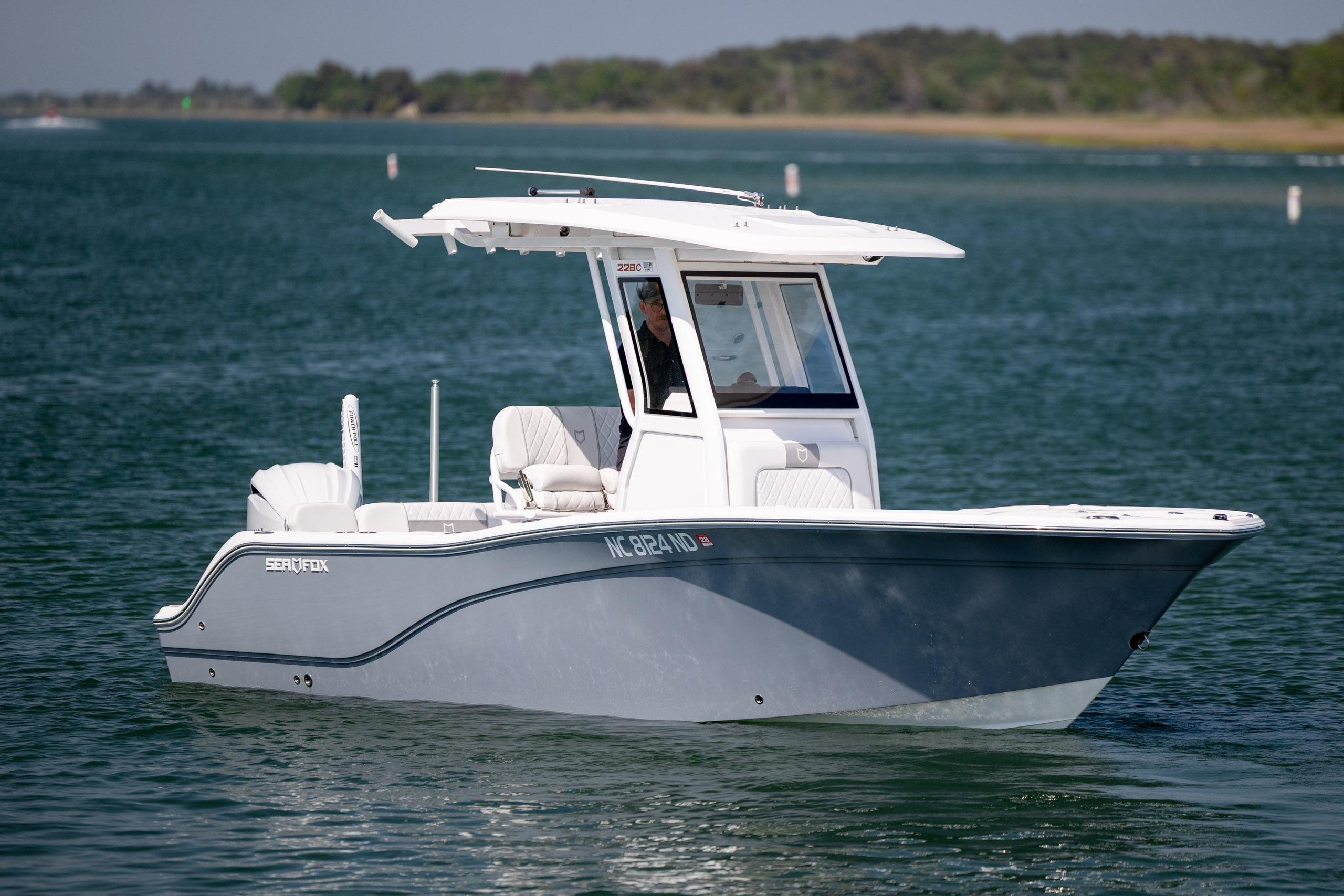 2025 Sea Fox 228 Commander boat cruising on a serene lake.