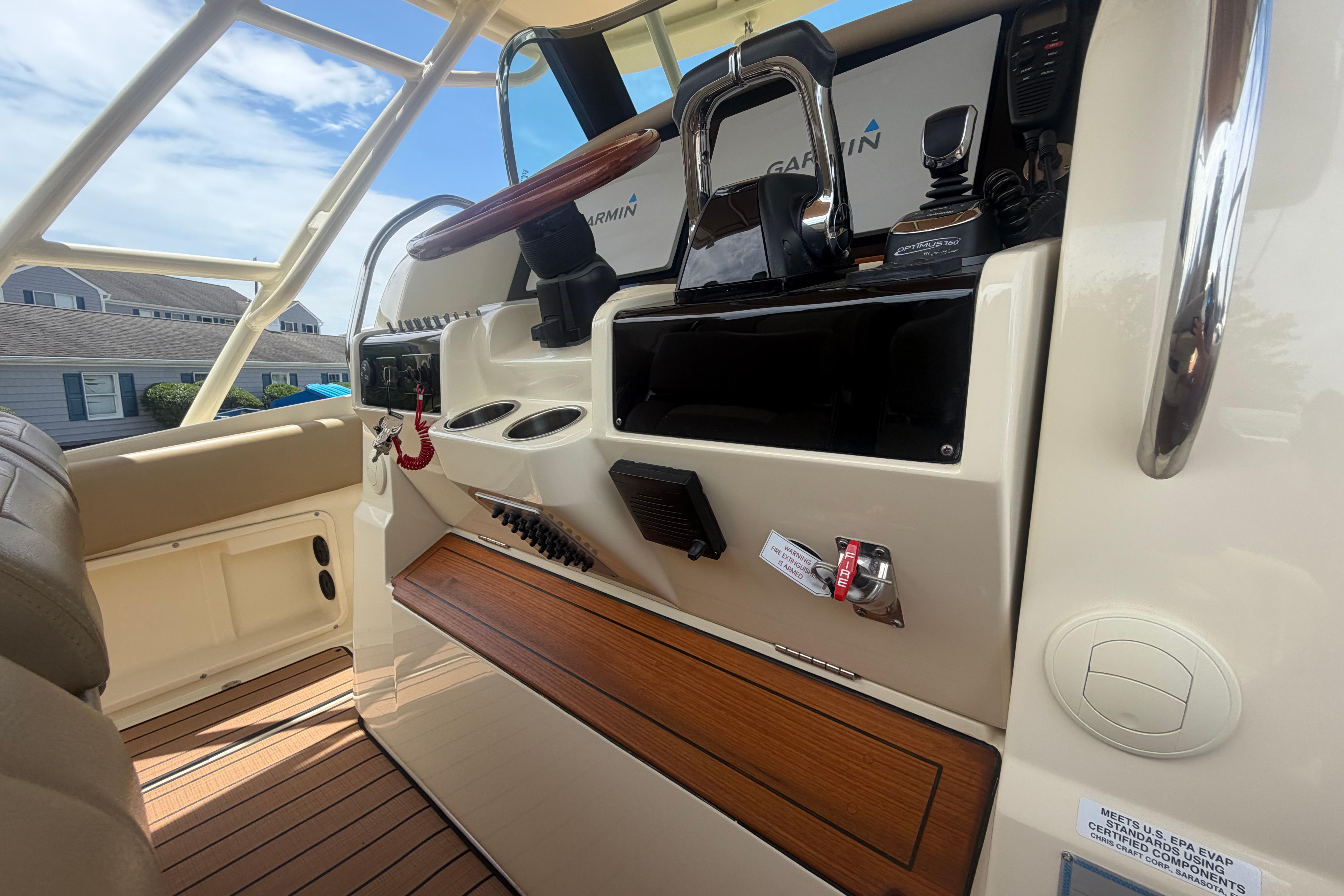 2017 Chris-Craft Catalina 34 helm with Garmin electronics and teak accents.