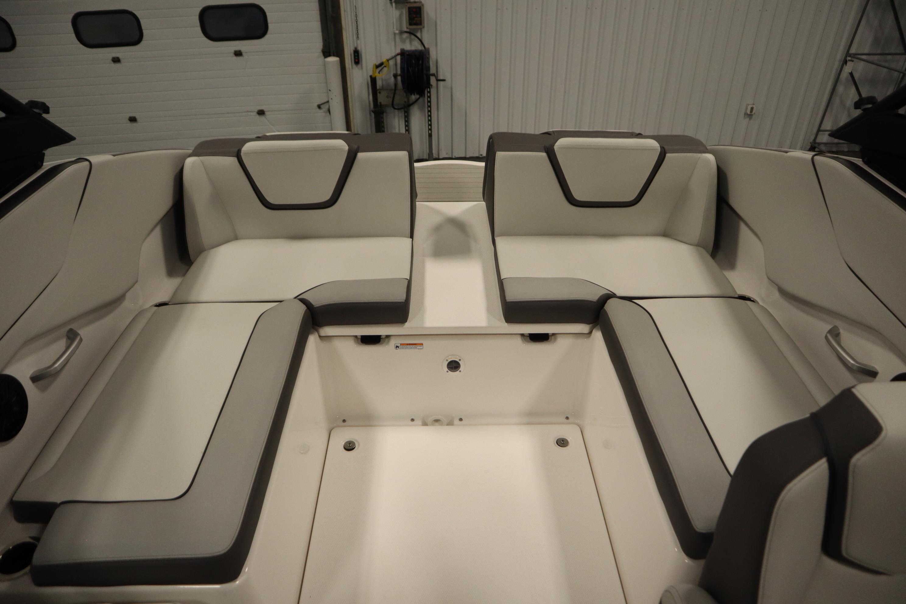 2026 Yamaha Boats AR250 interior seating with sleek, modern design in a showroom setting.