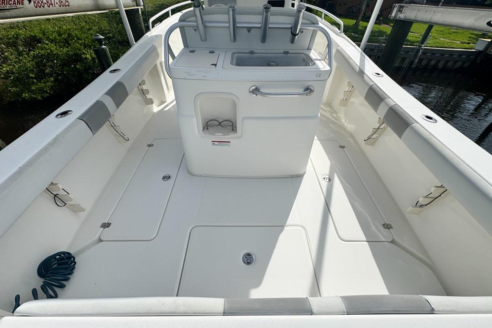 2018 Mako 284 Center Console boat interior with storage compartments and fishing rod holders.