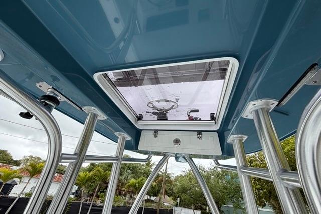 2025 Contender 26 Bay boat interior, featuring a sleek roof hatch and sturdy metal supports.