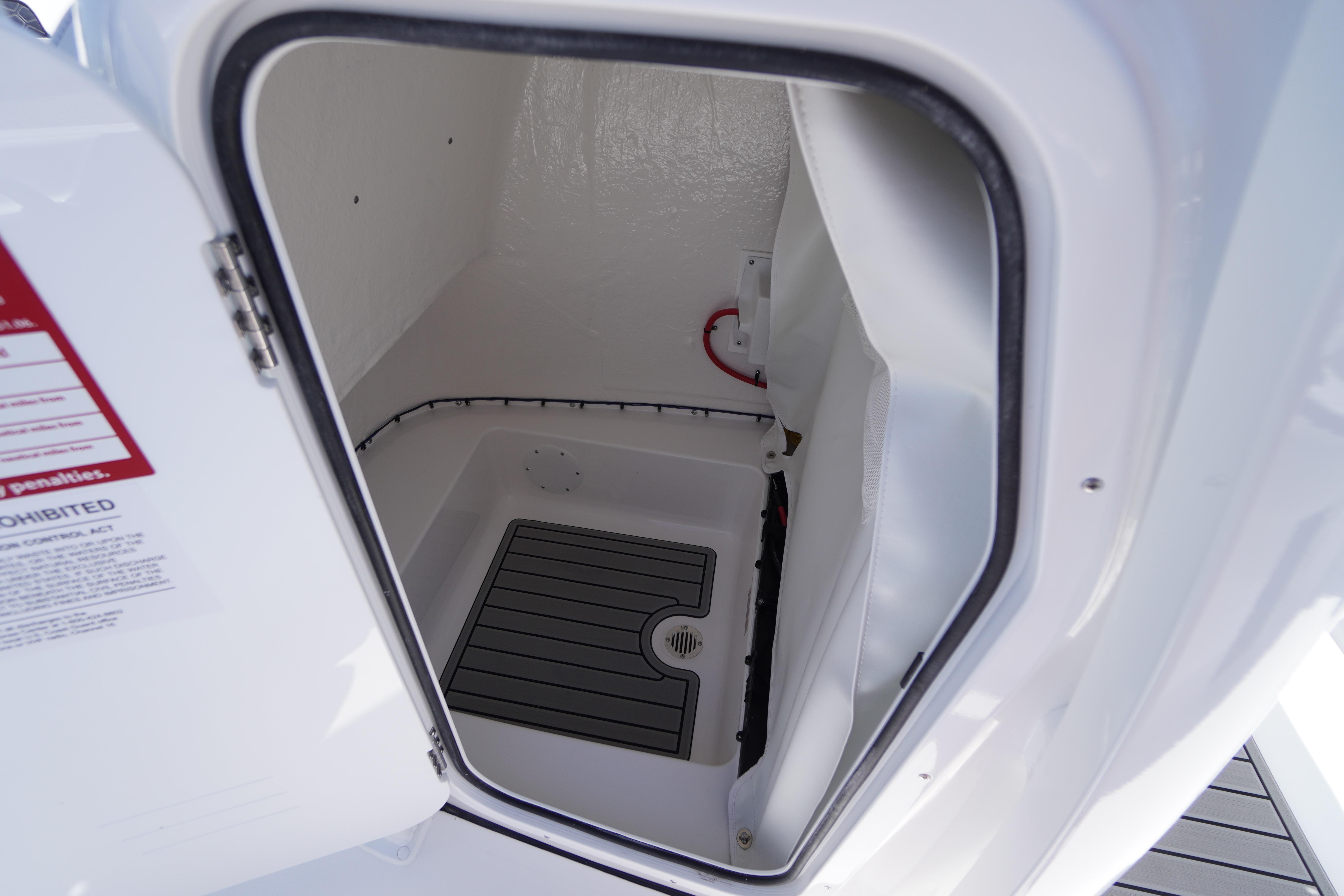 2026 Tidewater 220 CC Adventure boat storage compartment interior.