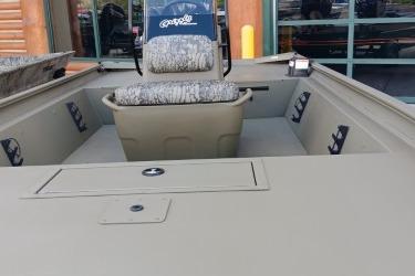 2026 Tracker Grizzly 1860 CC boat interior with seating and storage compartments.
