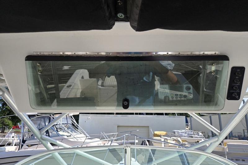 2004 Robalo R235 Walkaround boat dashboard with glass panel and control buttons.