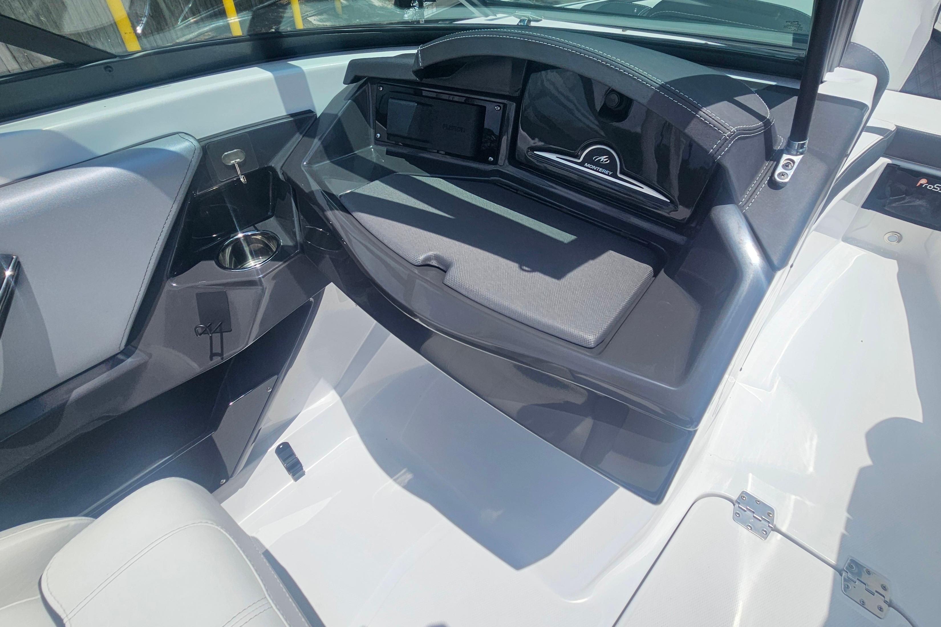Interior view of 2024 Monterey 215SS Super Sport boat, featuring sleek dashboard and seating.