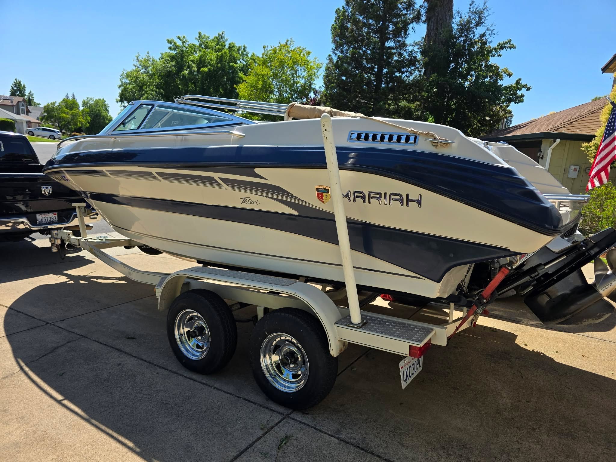 1996 Mariah Talari boat parked on trailer outdoors.