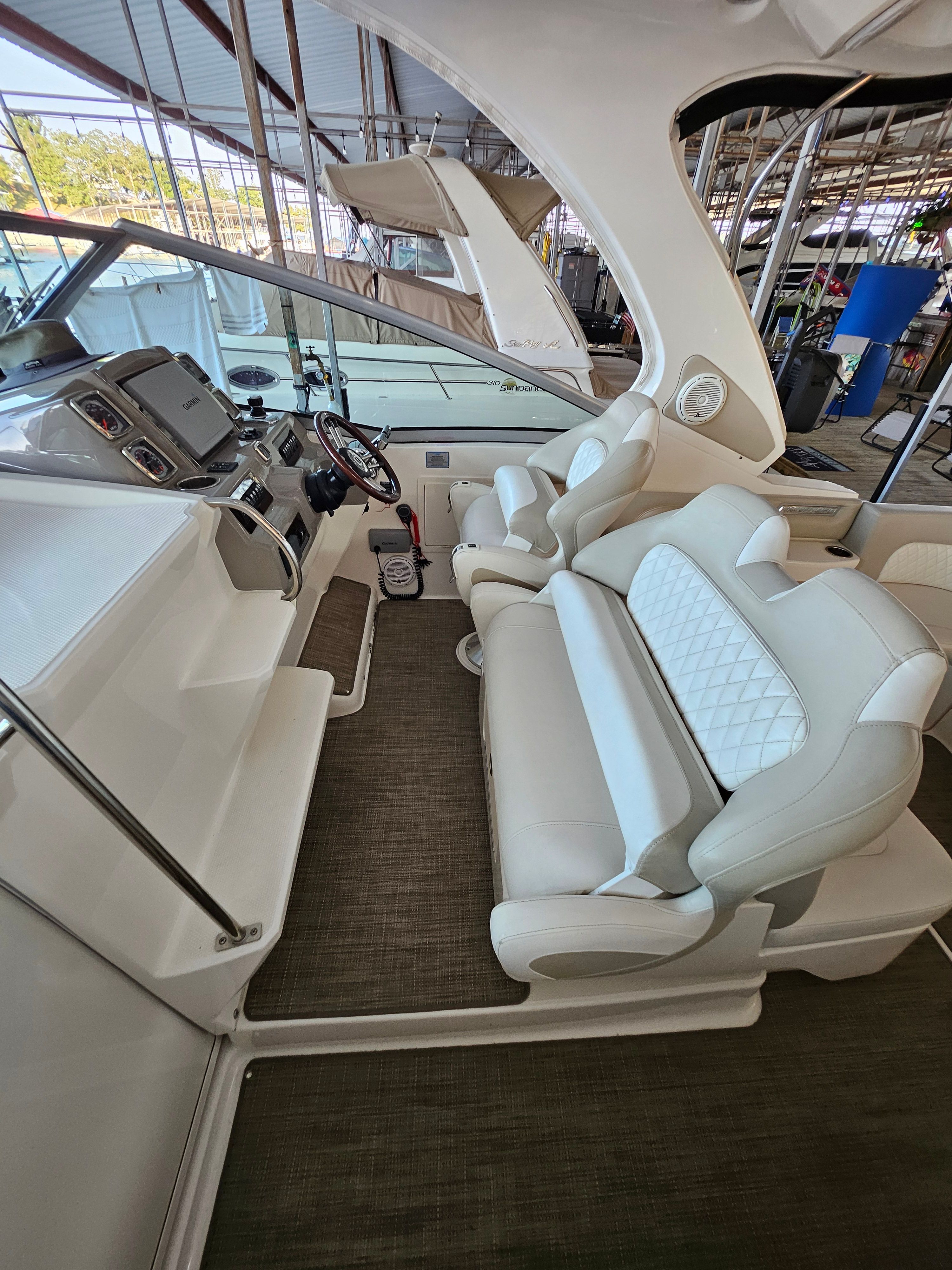 Interior of a 2014 Chaparral 330 Signature boat with luxurious seating.