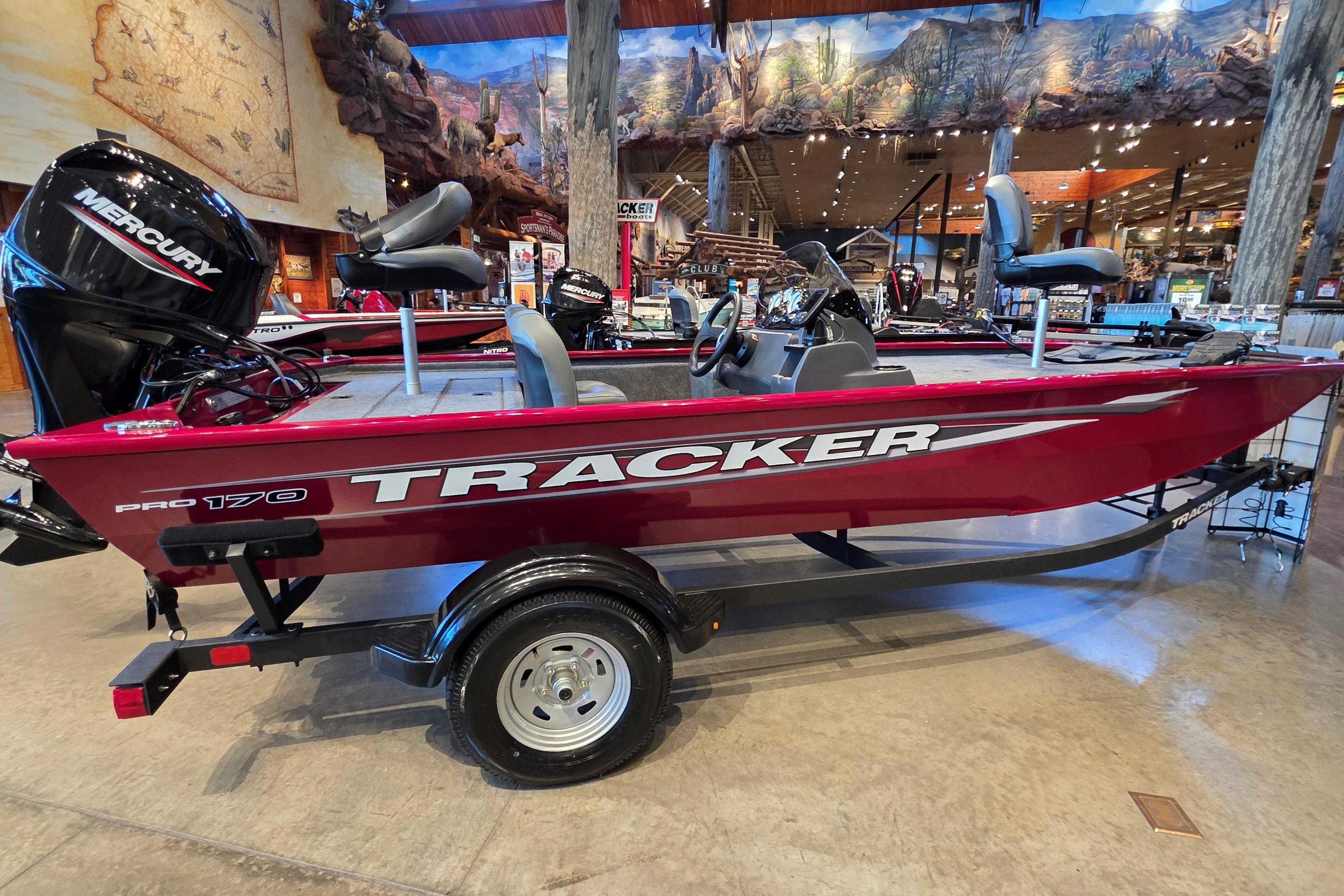2026 Tracker Pro 170 boat displayed indoors with Mercury engine.