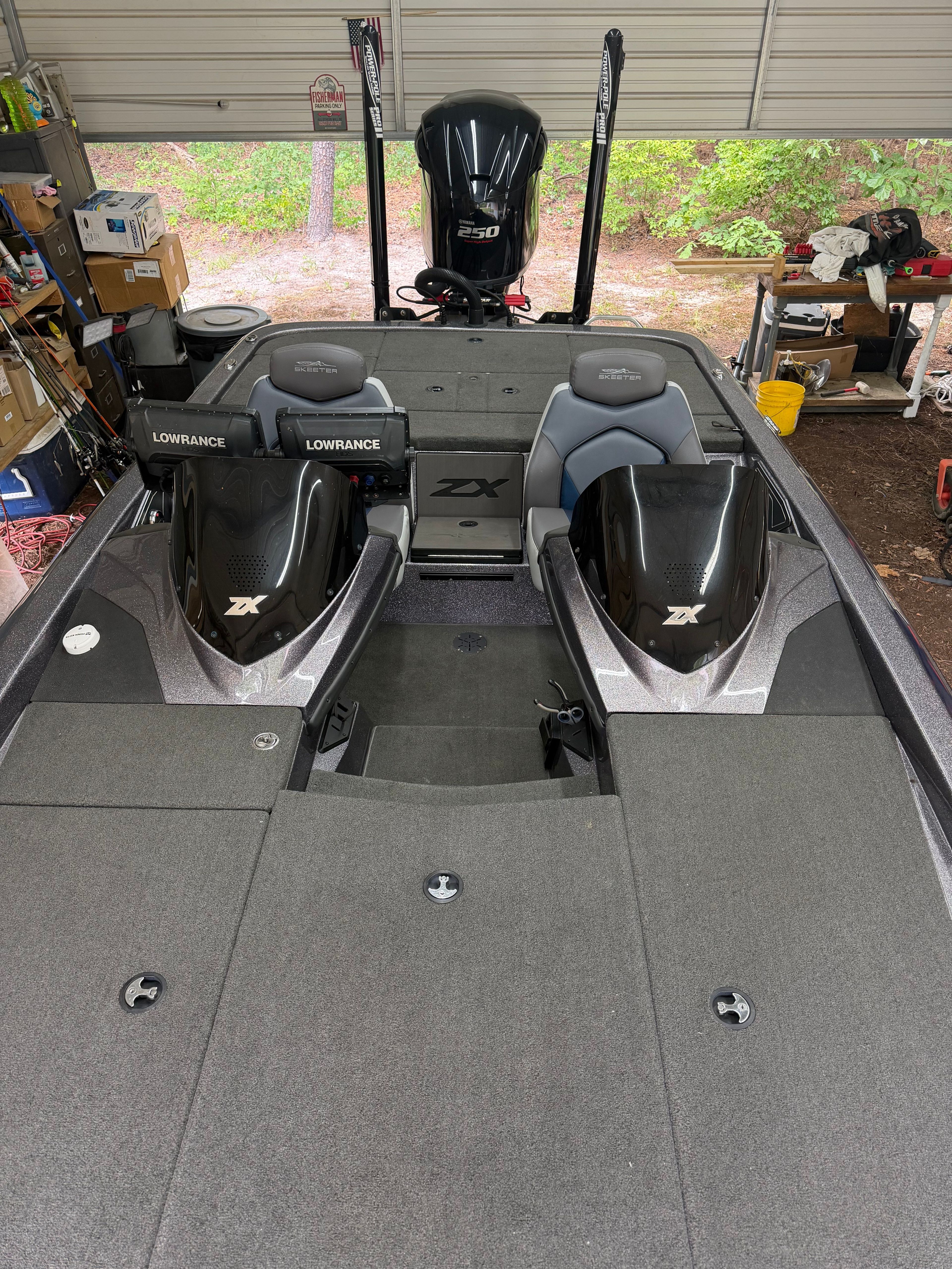 The image shows the cockpit of a 2017 Skeeter ZX250 boat with two seats and a console.