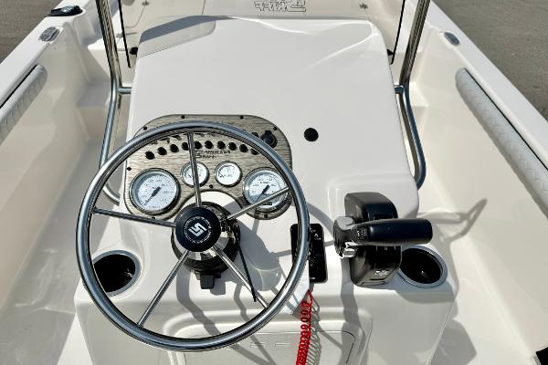 2025 Carolina Skiff 21 LS boat console with steering wheel and gauges.