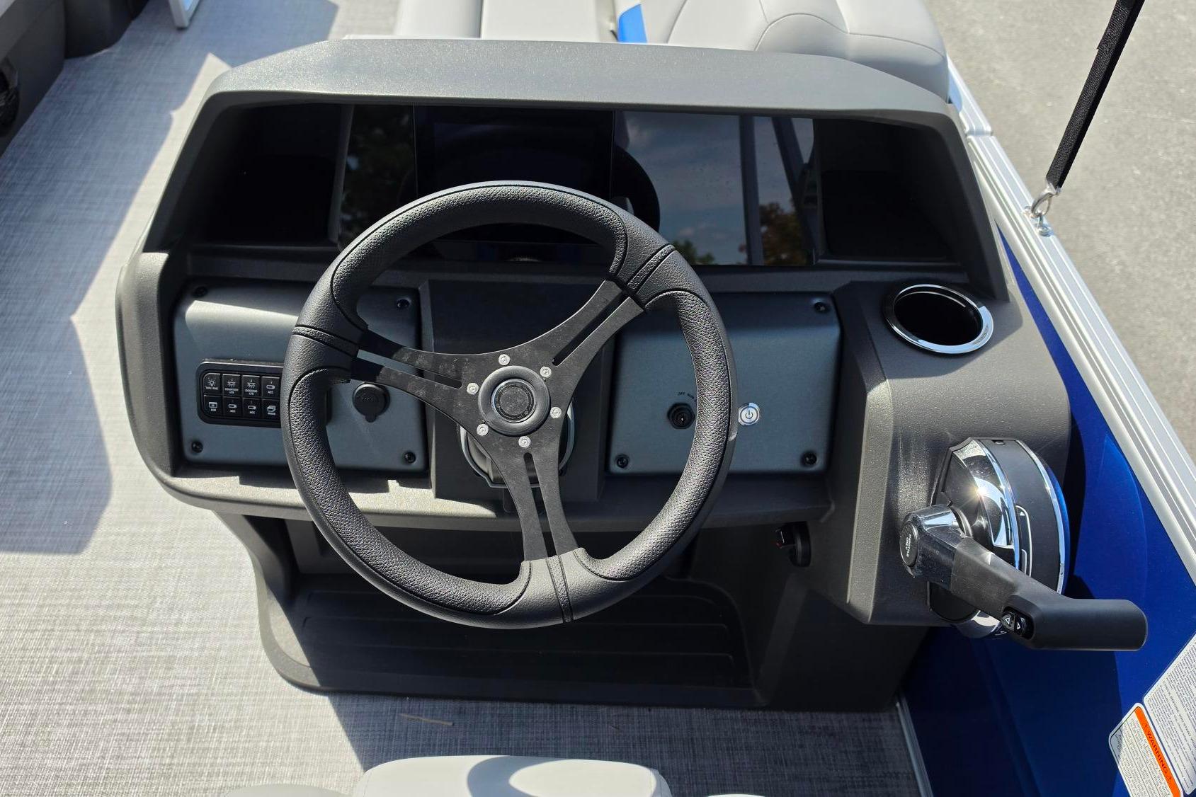 Steering console of 2026 Sun Tracker Party Barge 20 DLX pontoon boat.