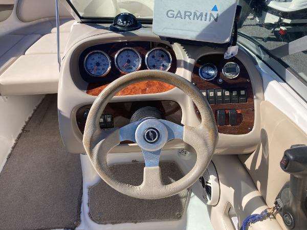2008 Chaparral 210 SSi boat dashboard with Garmin GPS and wood accents.