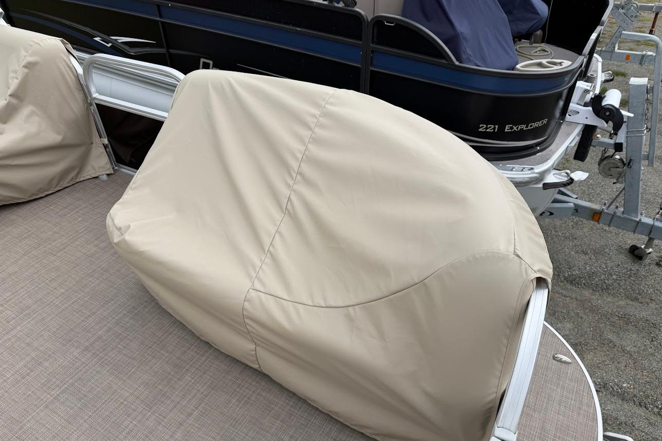 2025 Sun Tracker Party Barge 16 DLX with covered seating on deck.