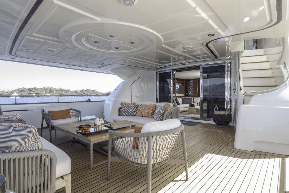 Luxurious CRN 129 yacht deck with elegant seating, ocean view, and modern design, 2009 model.