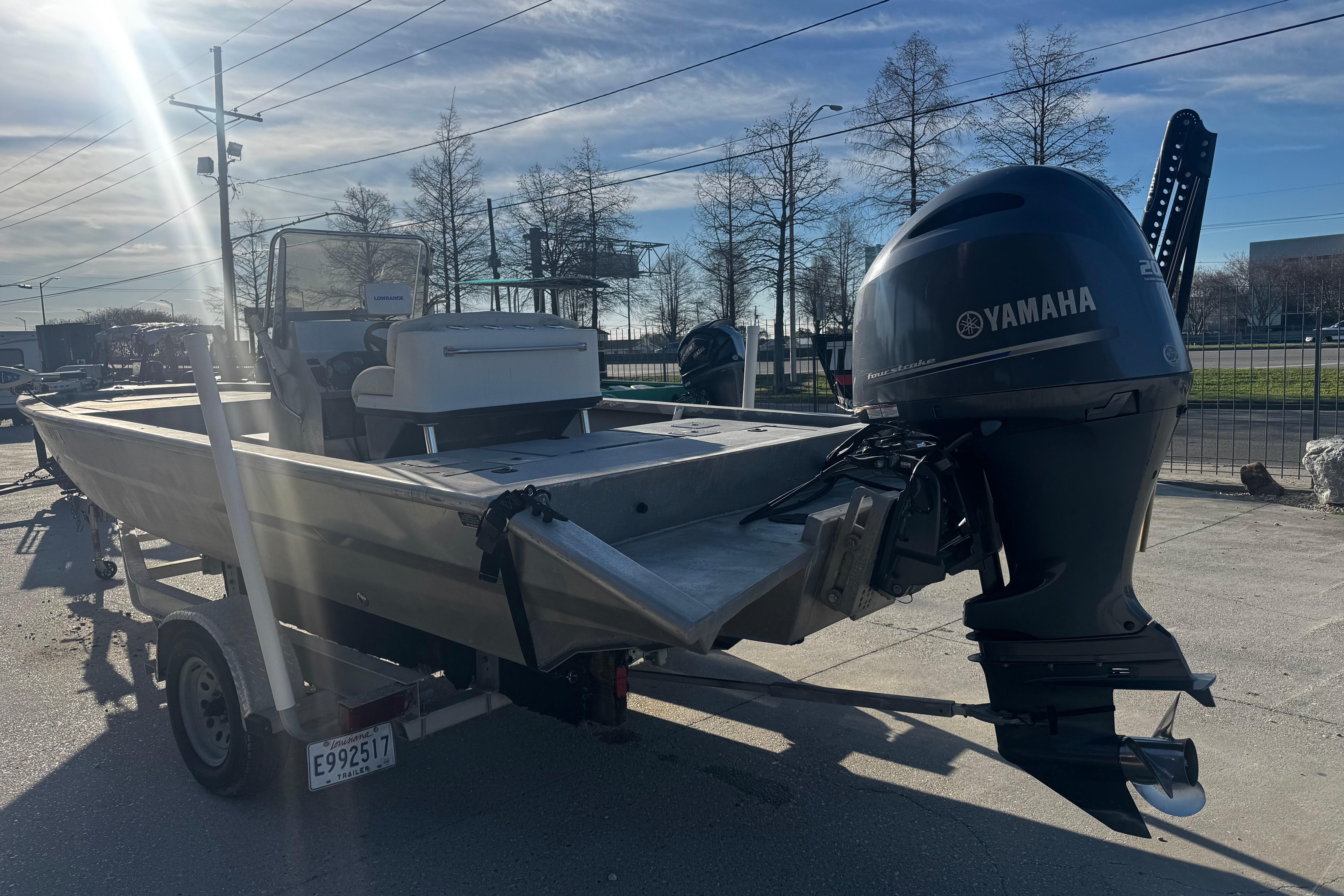 Custom Charles Leonard 21 boat with Yamaha engine on trailer, sunny day, 2004 model.