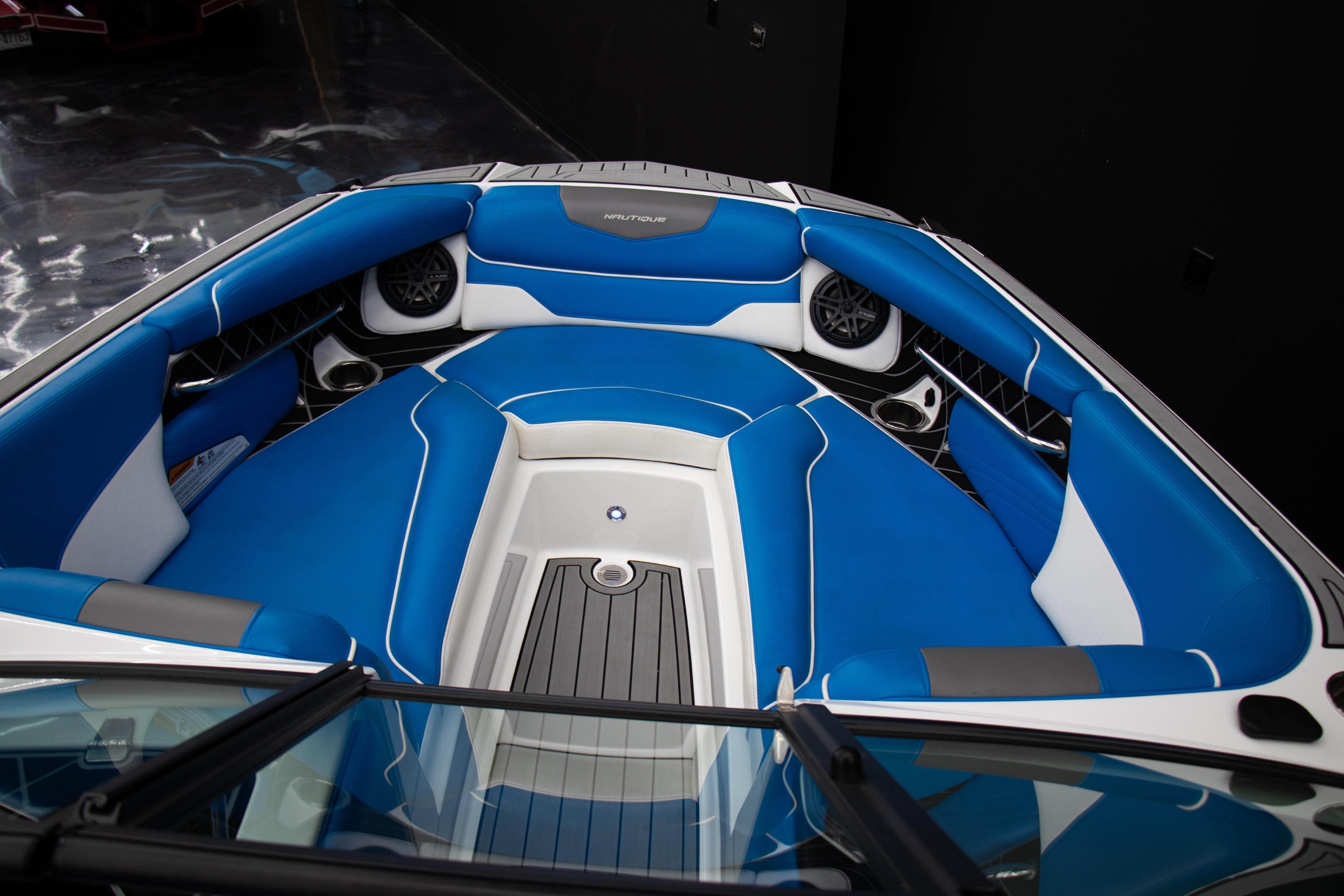 2018 Nautique Super Air Nautique GS22 boat interior with blue and white seating.