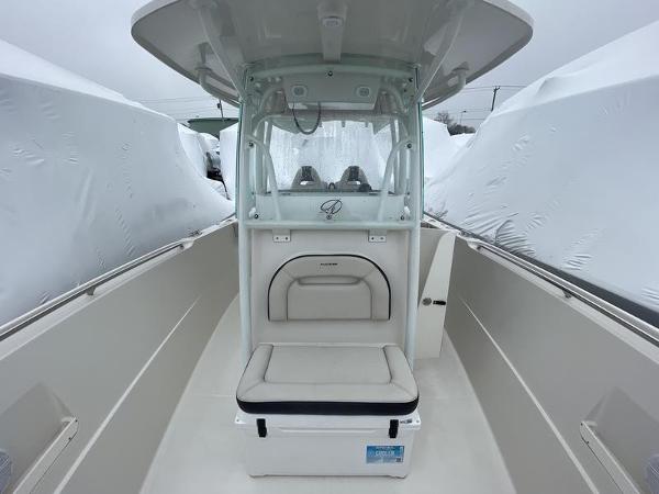 2023 Sailfish 290 CC boat interior with seating and console, showcasing modern design.