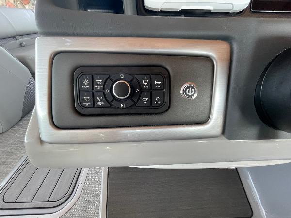 Control panel of 2024 Regency 230 DL3 boat with various function buttons.