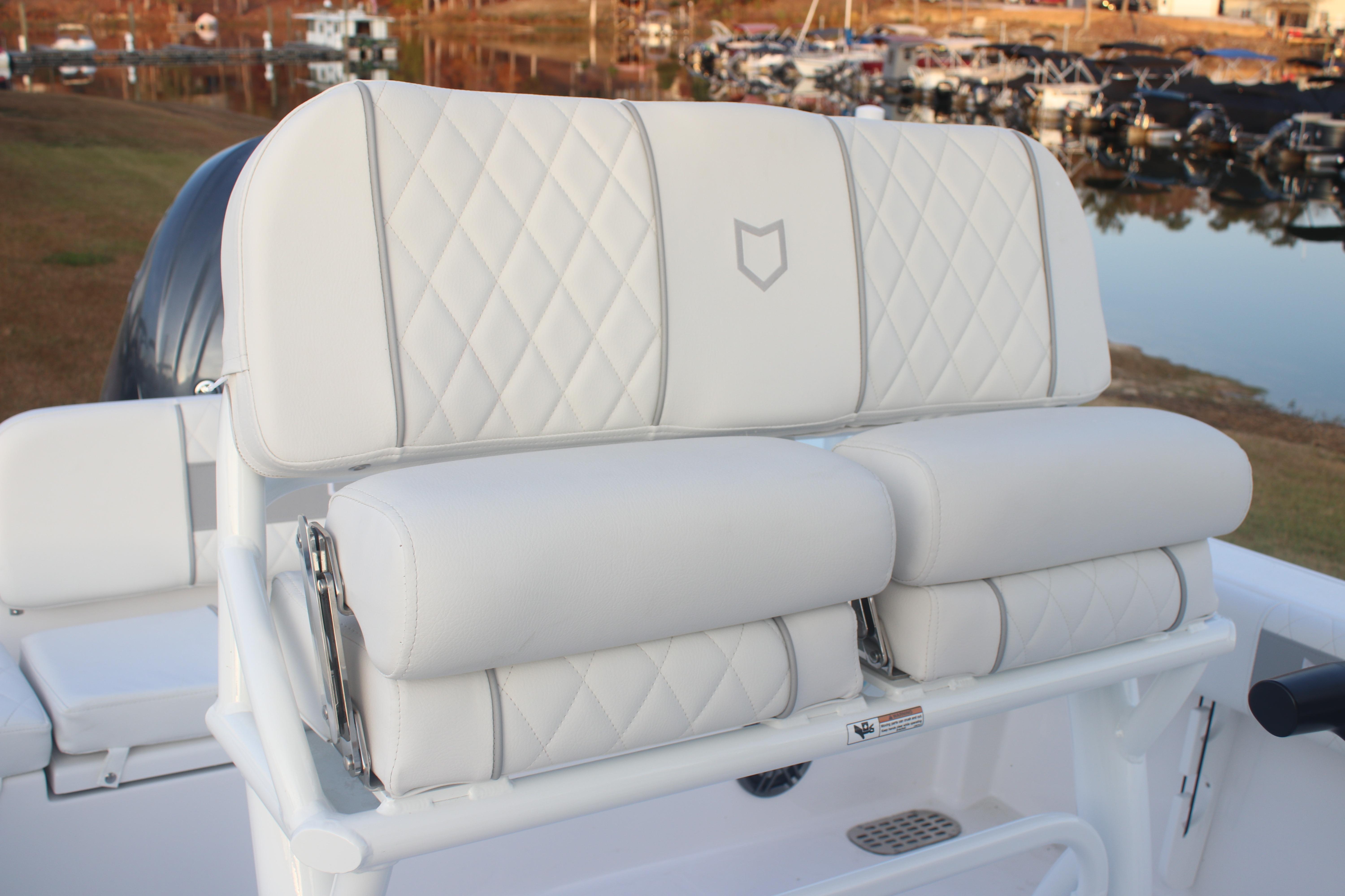 2026 Sea Fox 228 Commander boat seat with diamond-stitched white upholstery.