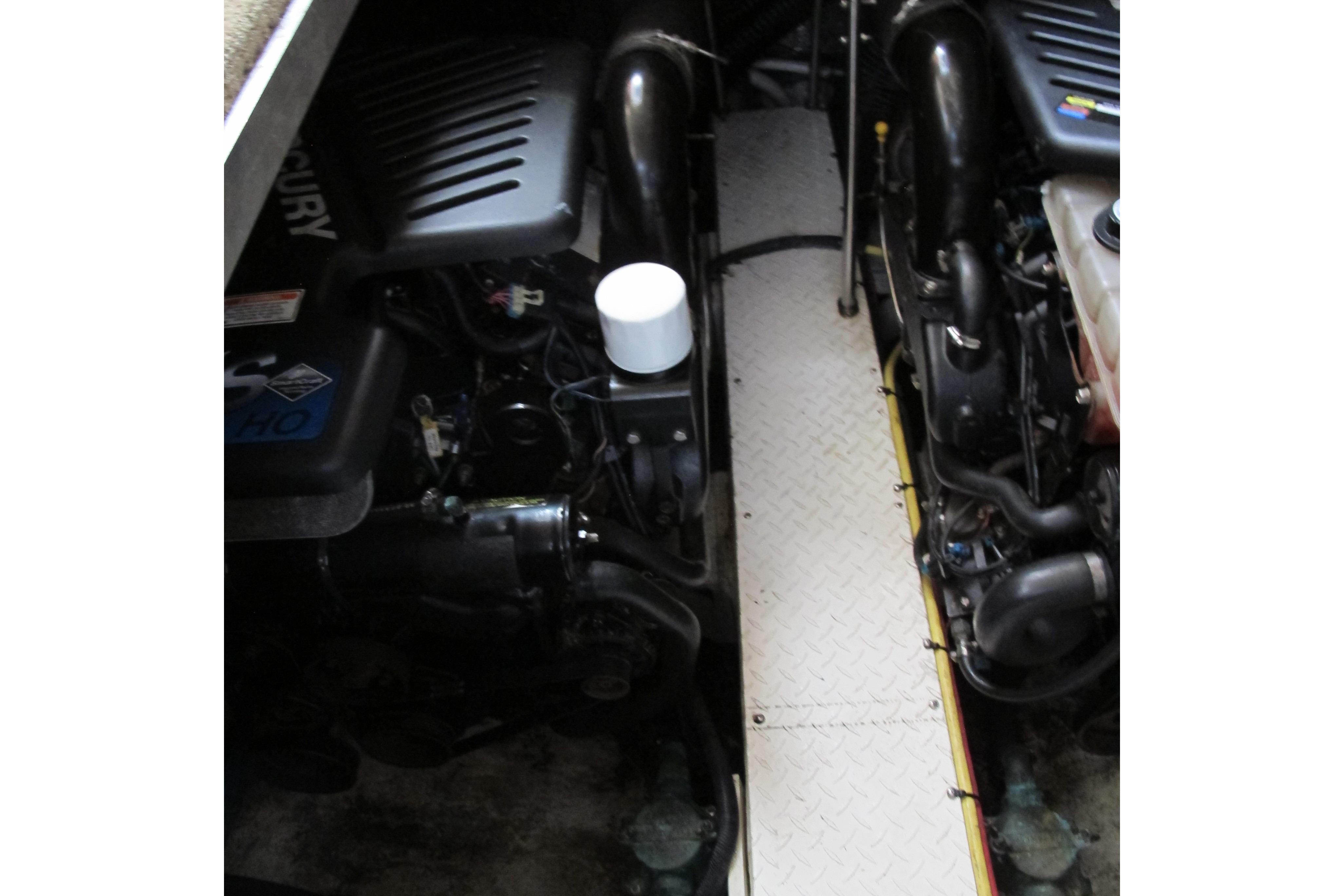 Engine compartment of 2006 Cruisers Yachts 385 Motoryacht, featuring dual Mercury engines.