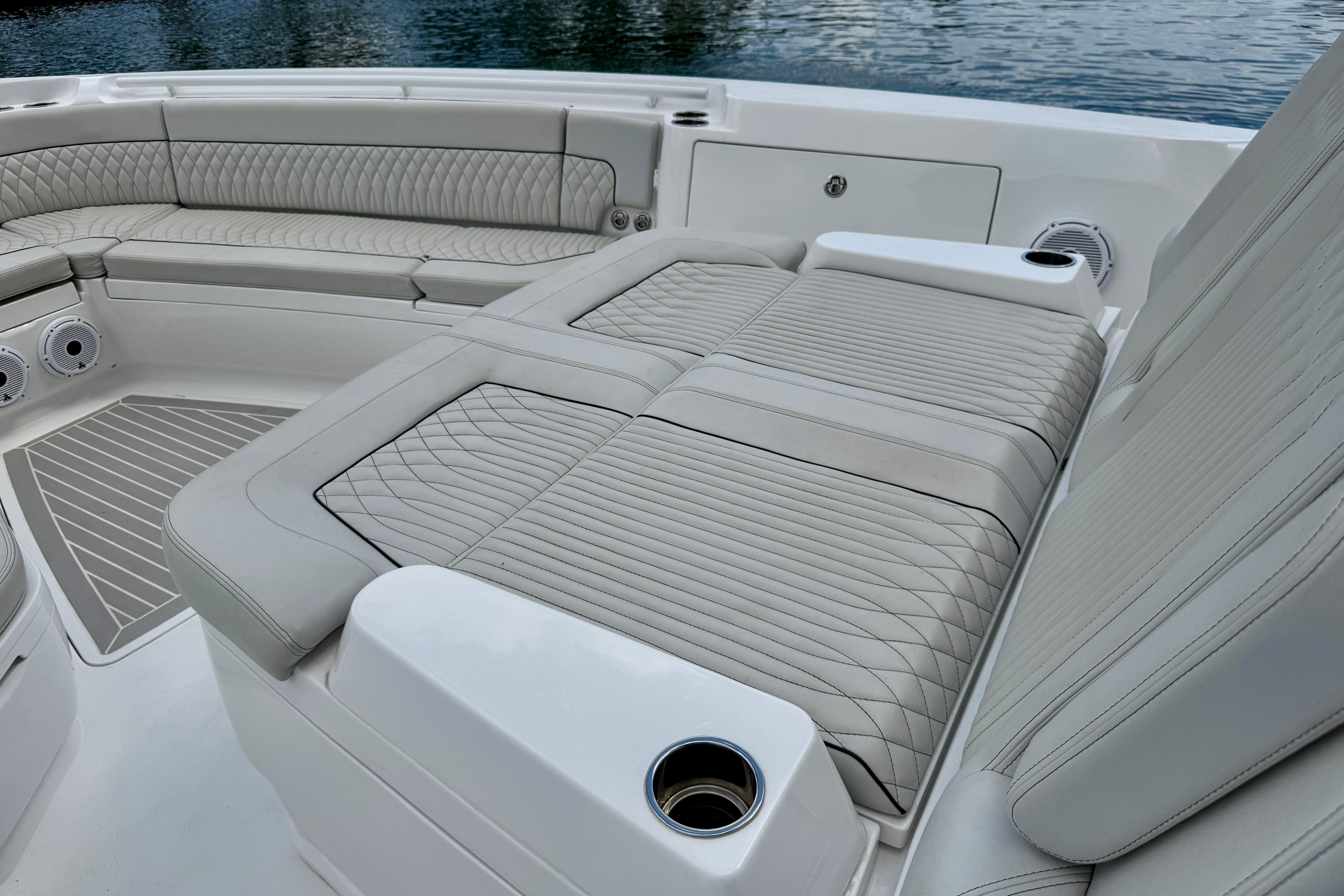 Luxurious seating on 2024 Intrepid 427 Nomad SE boat, featuring elegant quilted upholstery.
