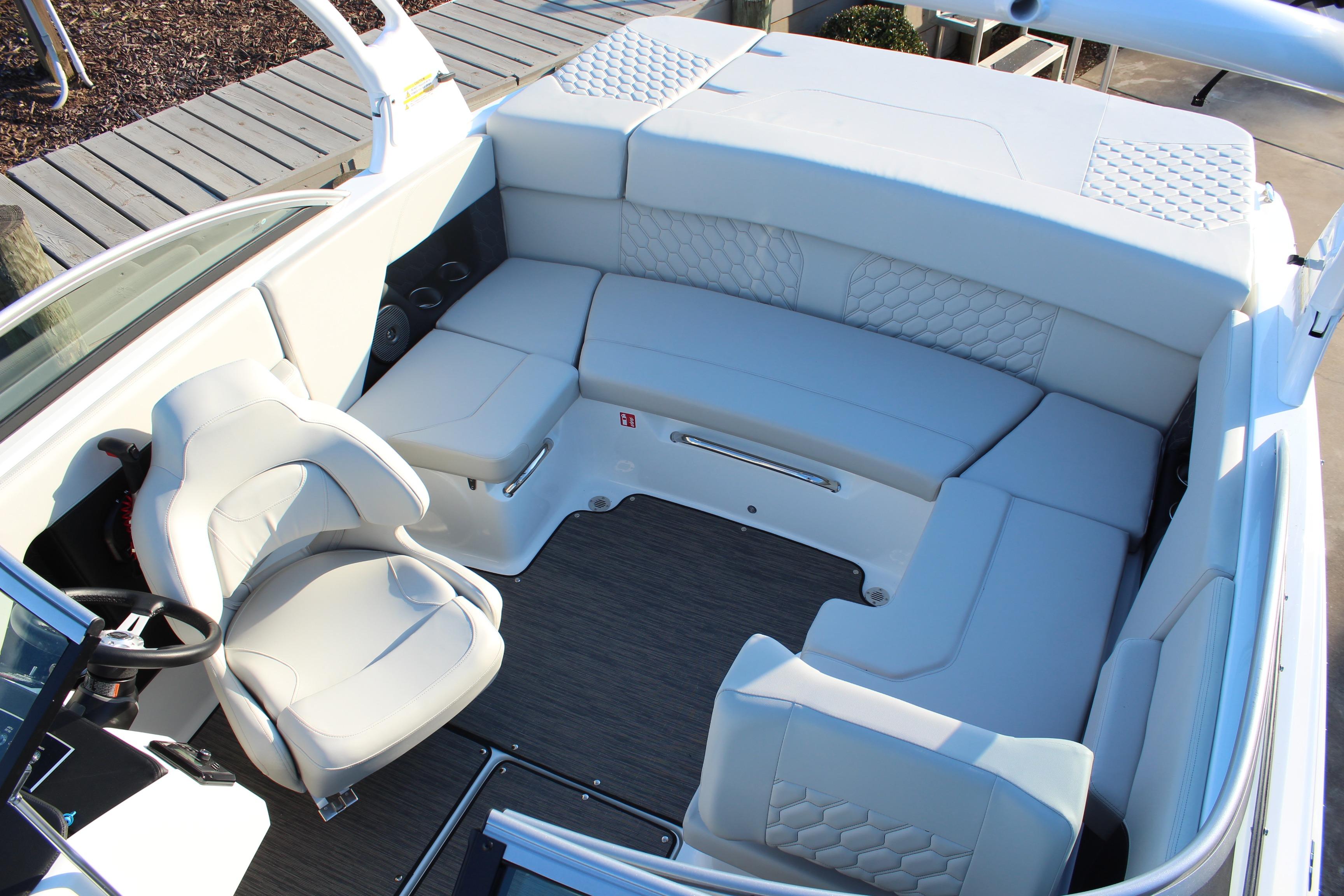 2026 Four Winns H2 Freedom boat interior with white seating and modern design.