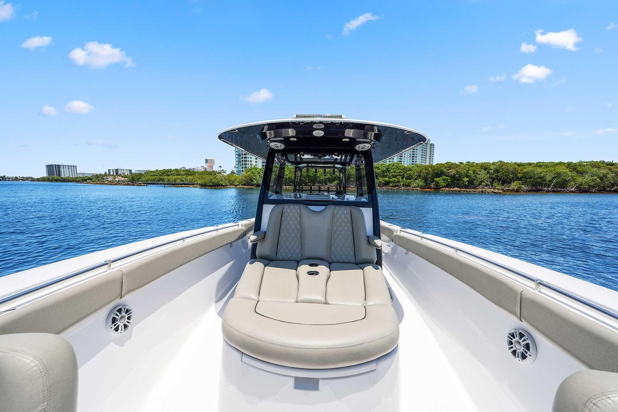2024 Sportsman Open 352 Center Console boat on calm water, clear sky background.
