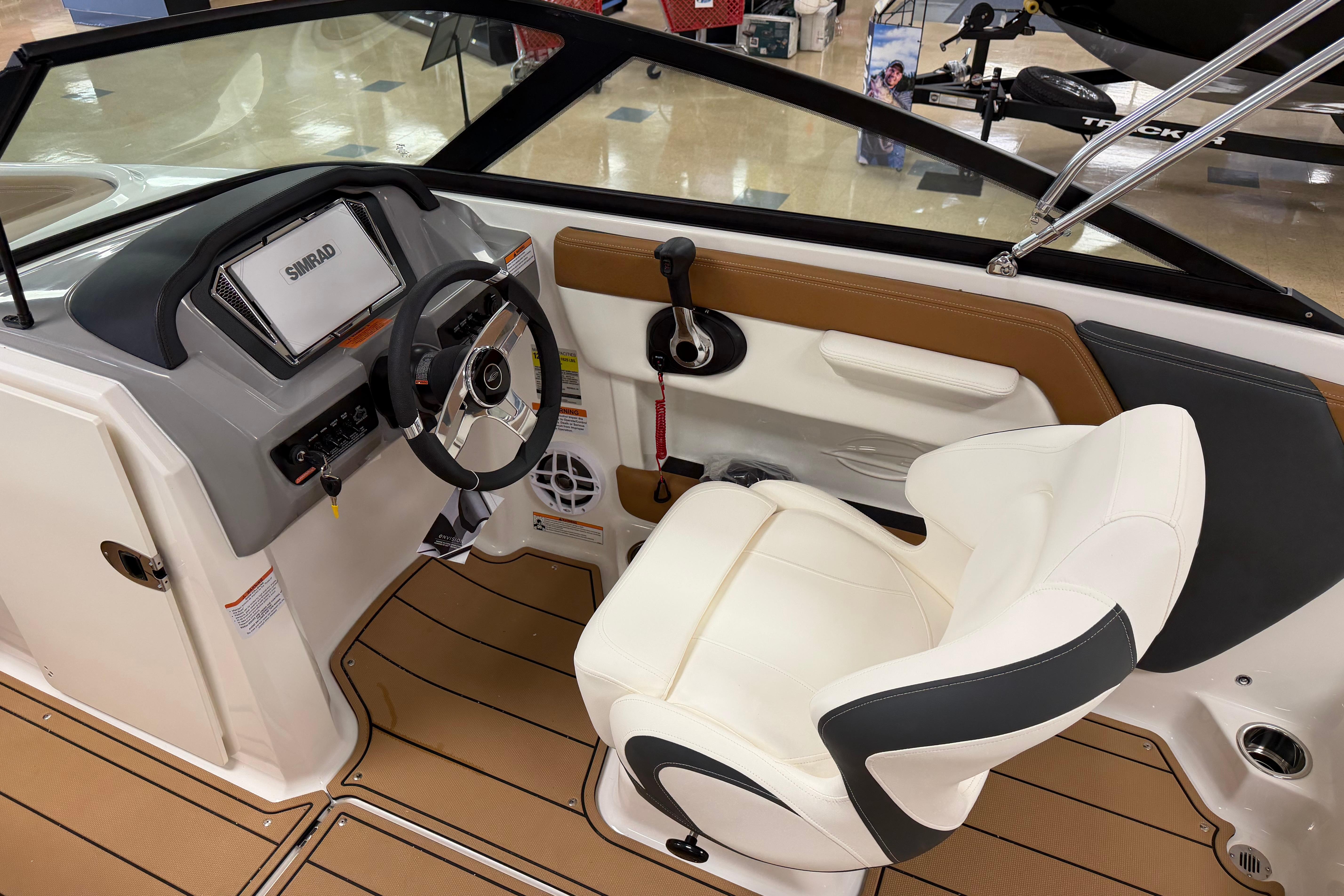 Interior of 2026 Chaparral 21 SSi Ski & Fish boat with modern dashboard and seating.