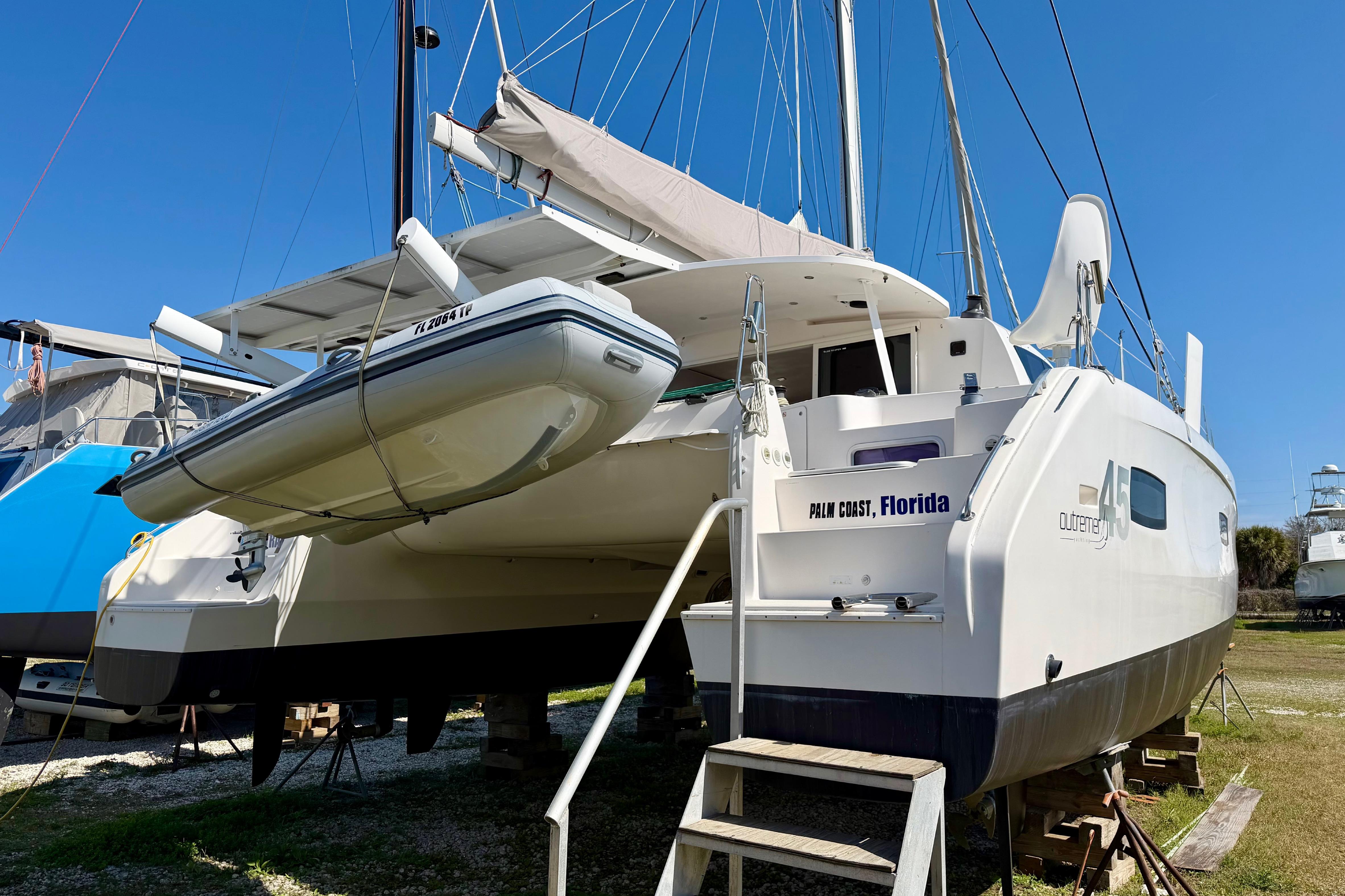2014 Outremer 45 catamaran in dry dock, Palm Coast, Florida, with inflatable dinghy.