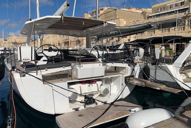 2017 Hanse 588 yacht docked in a marina, showcasing sleek design and modern features.