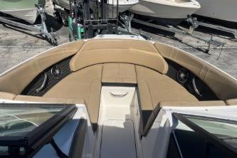 2024 Sea Ray SPX 230 boat interior with tan seating and sleek design.