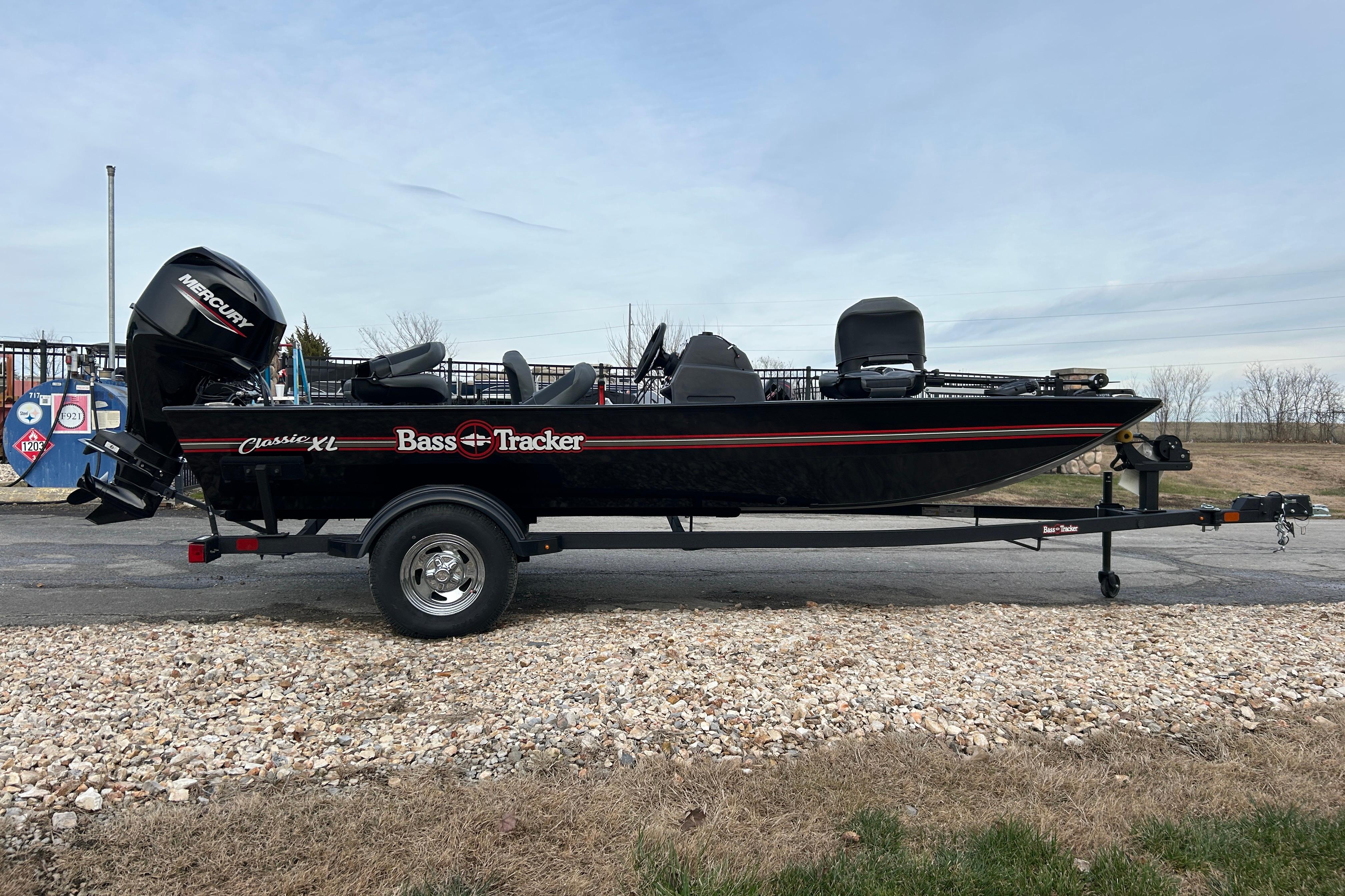 2026 Tracker Bass Tracker Classic XL boat on trailer, side view, outdoors.