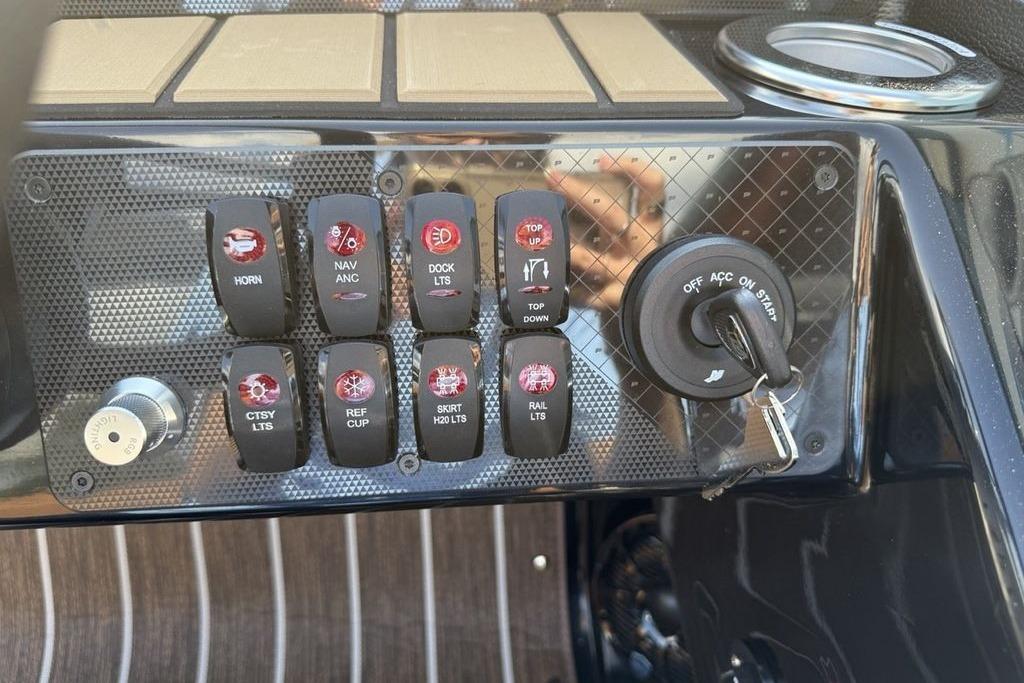 Control panel of 2026 Premier 250 Solaris RS CL boat with switches and ignition key.
