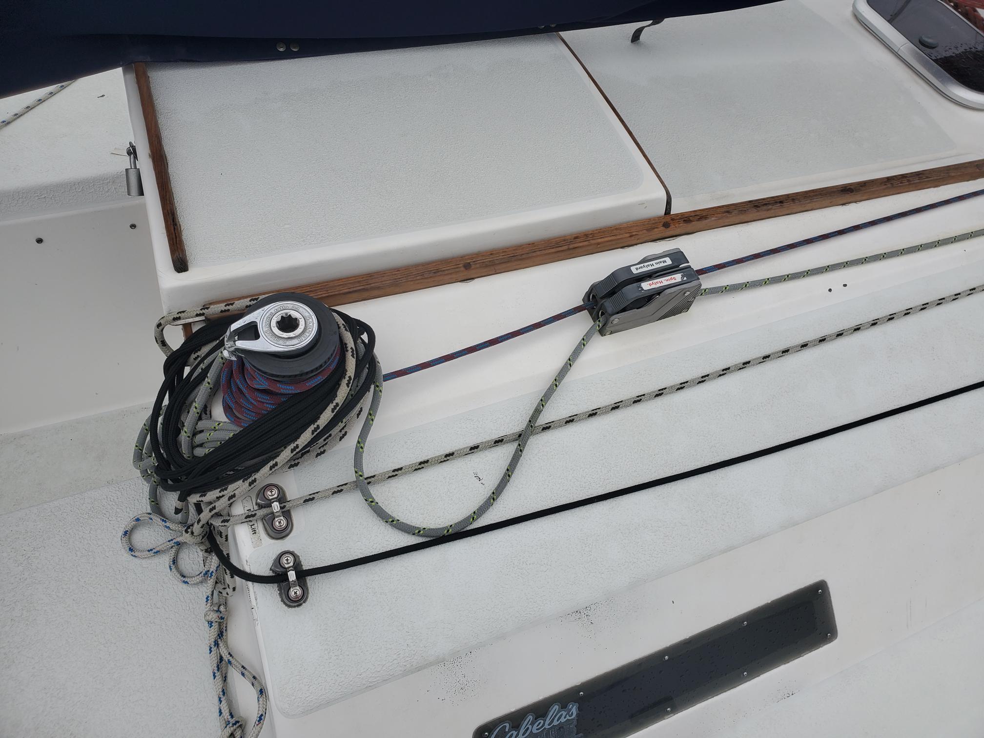 Deck of 2001 Schock 35 sailboat with rigging and winch.
